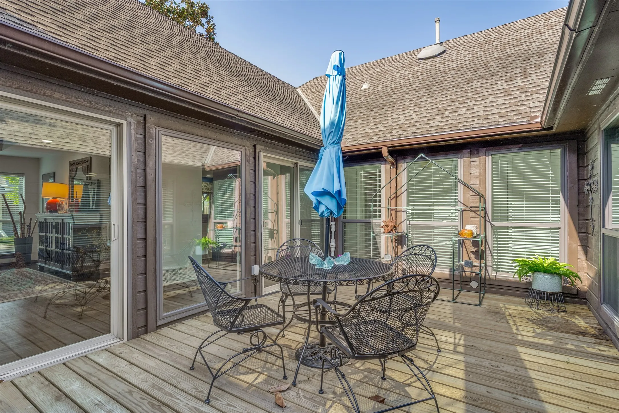 Interior Courtyard which is large enough for an outdoor table, chairs and plants