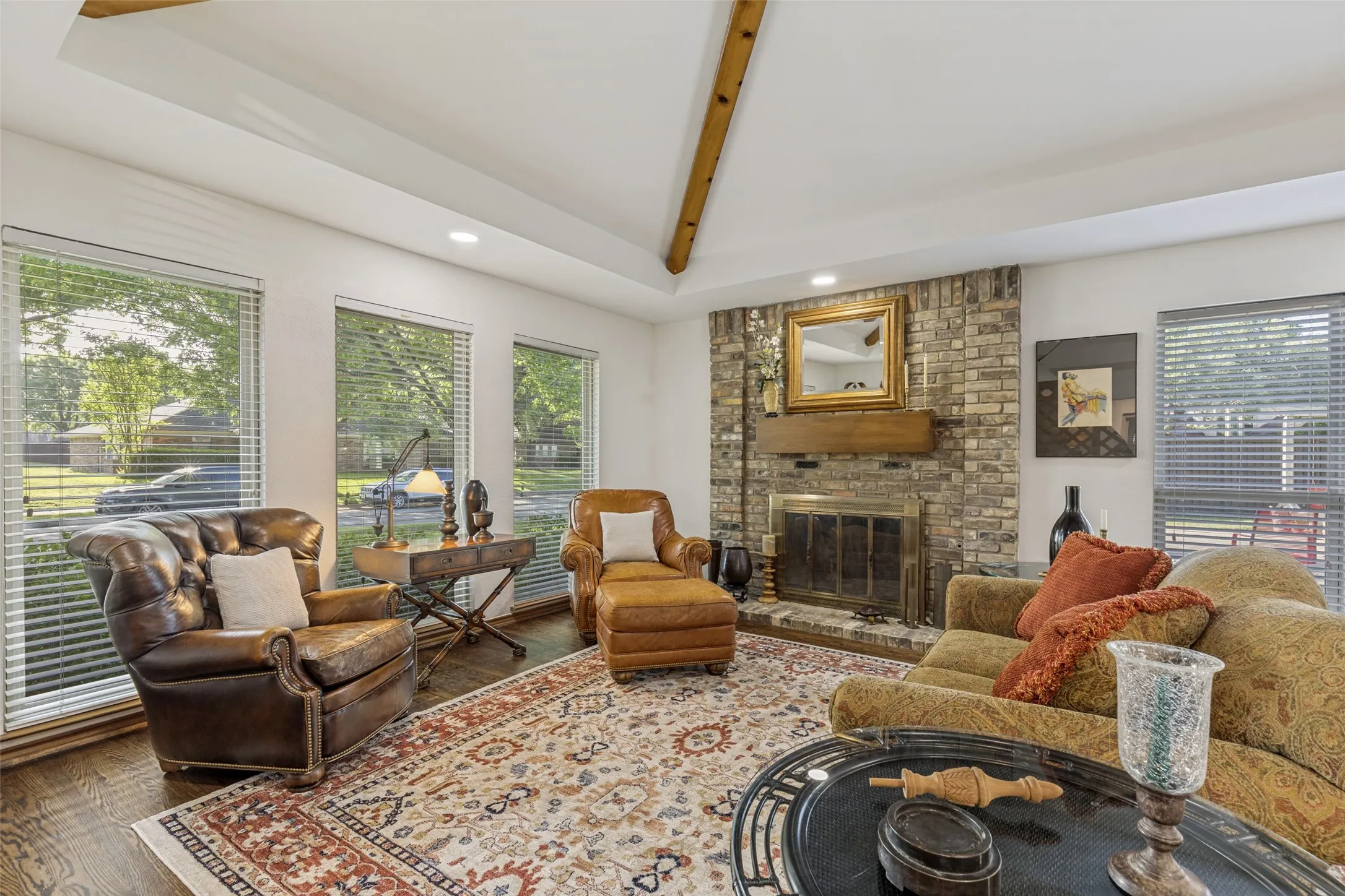 Formal Living Room with wood-burning fireplace with gas starter and vaulted ceiling