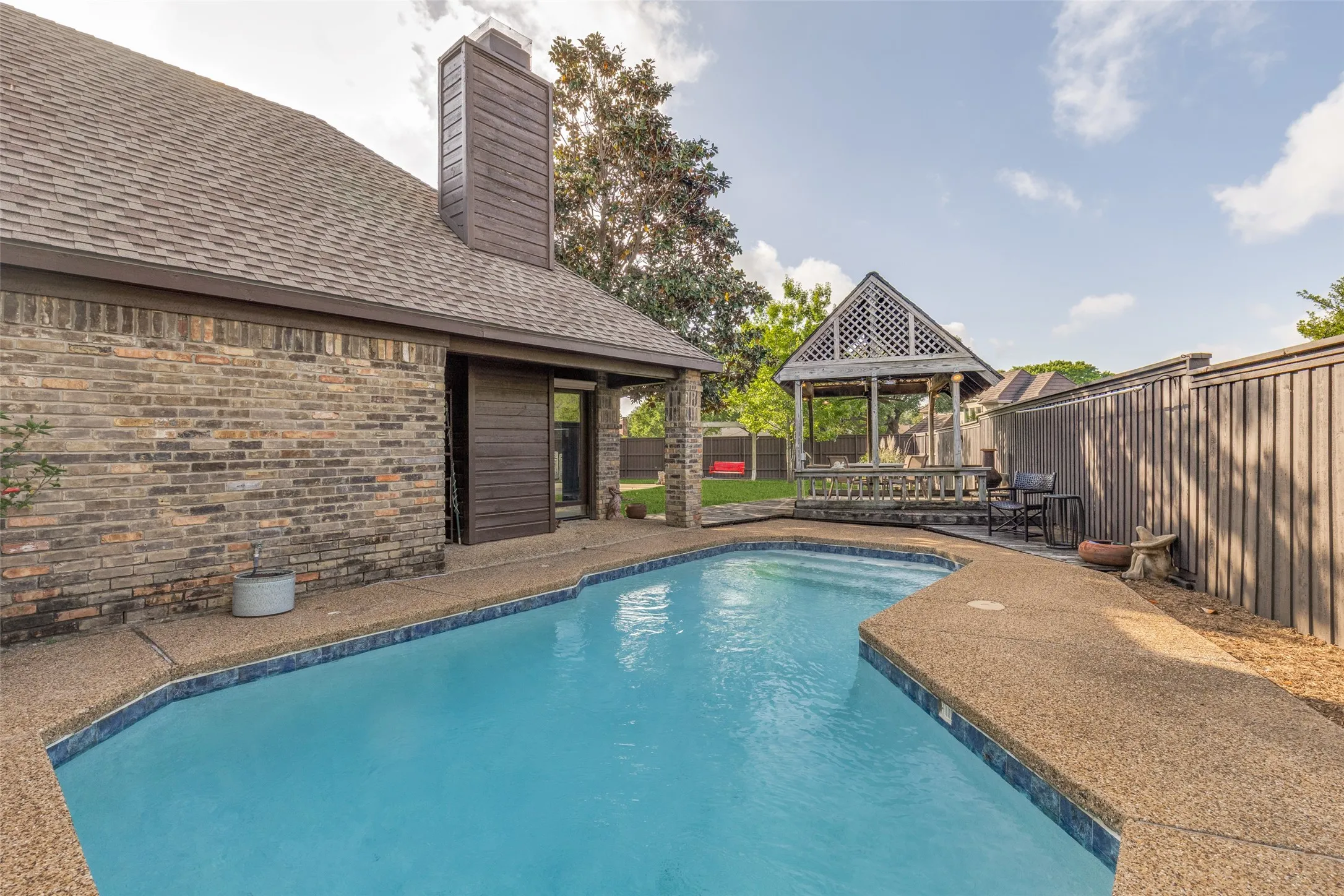 Beautiful in-ground pool and decking in back yard