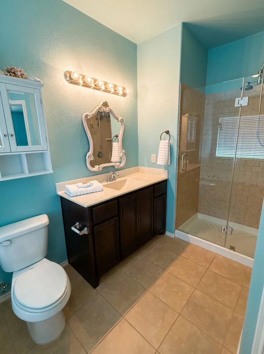 Primary bathroom with rimless shower and finishes.