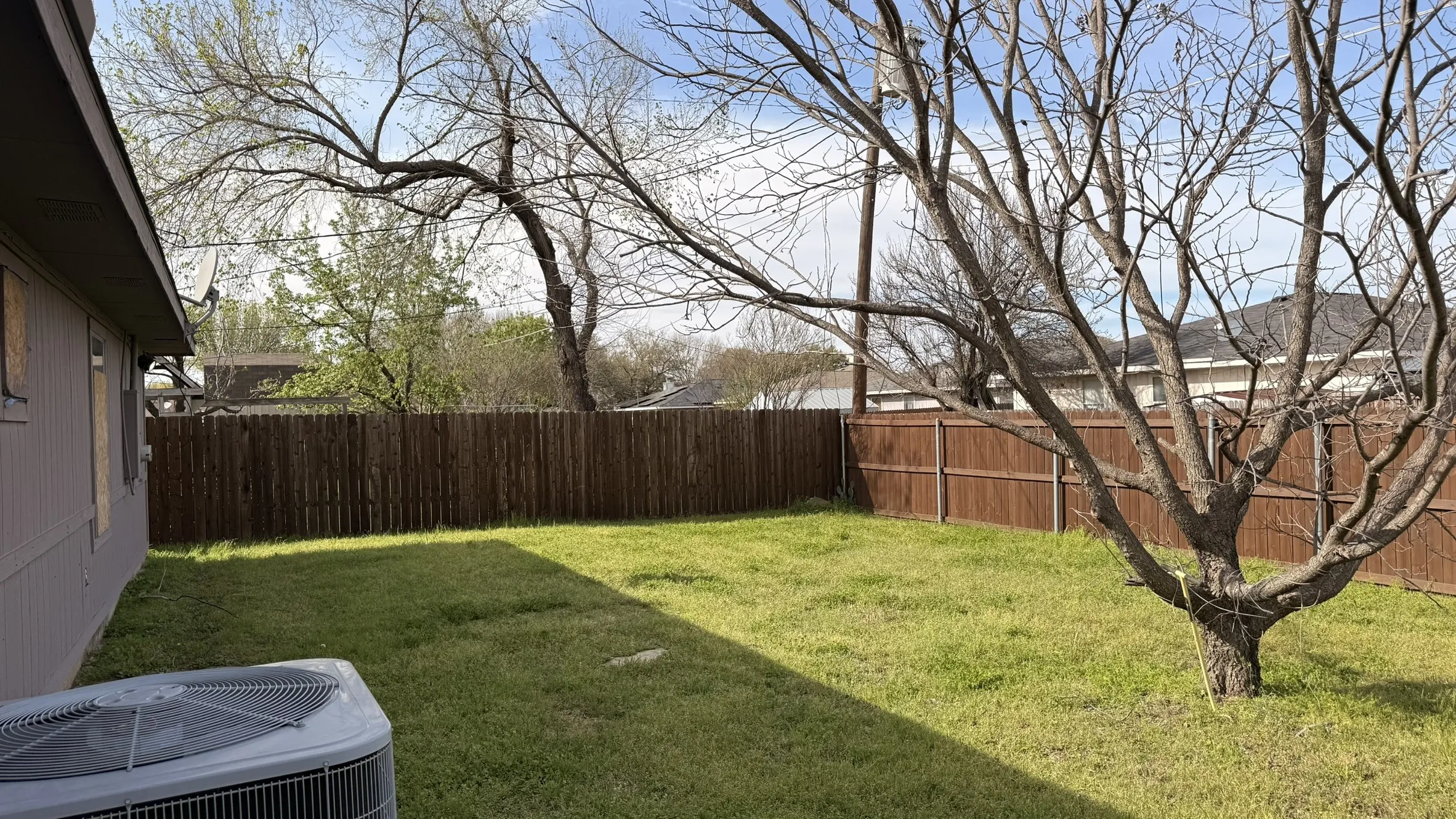 View of fenced backyard