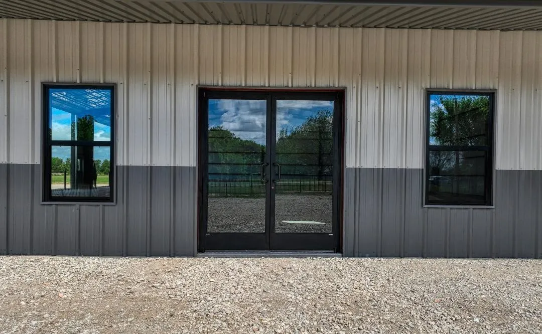 Front of building showing double glass doors