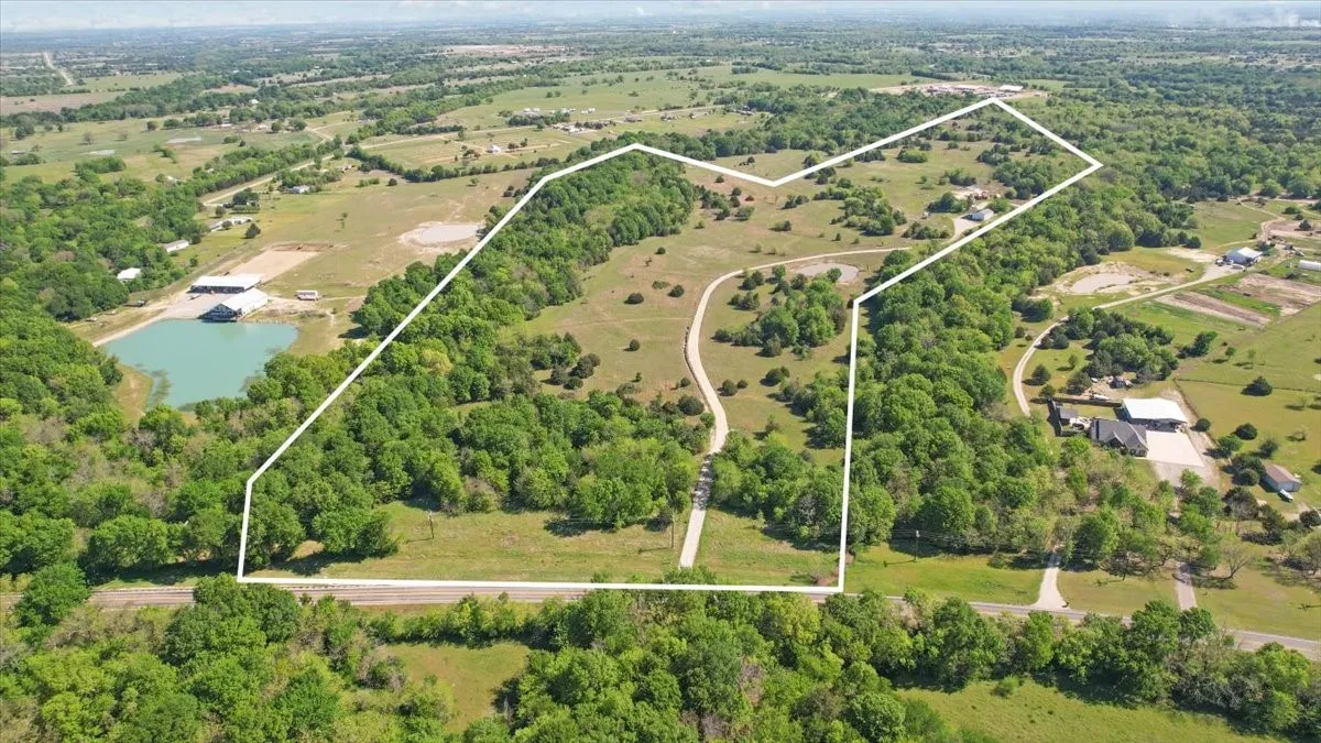 View of property location with property boundaries highlighted and a nearby body of water