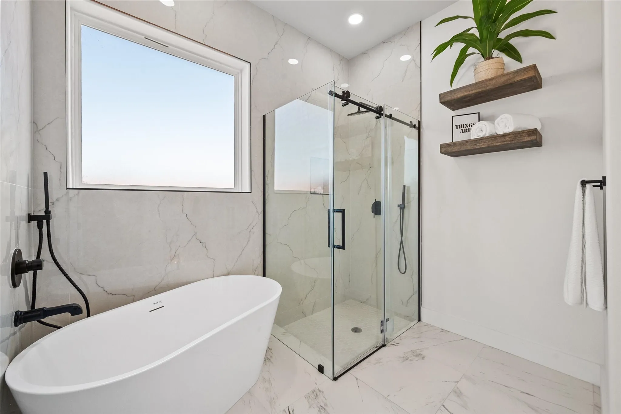 2nd Primary bathroom with soaking tub & shower w/glass barn door