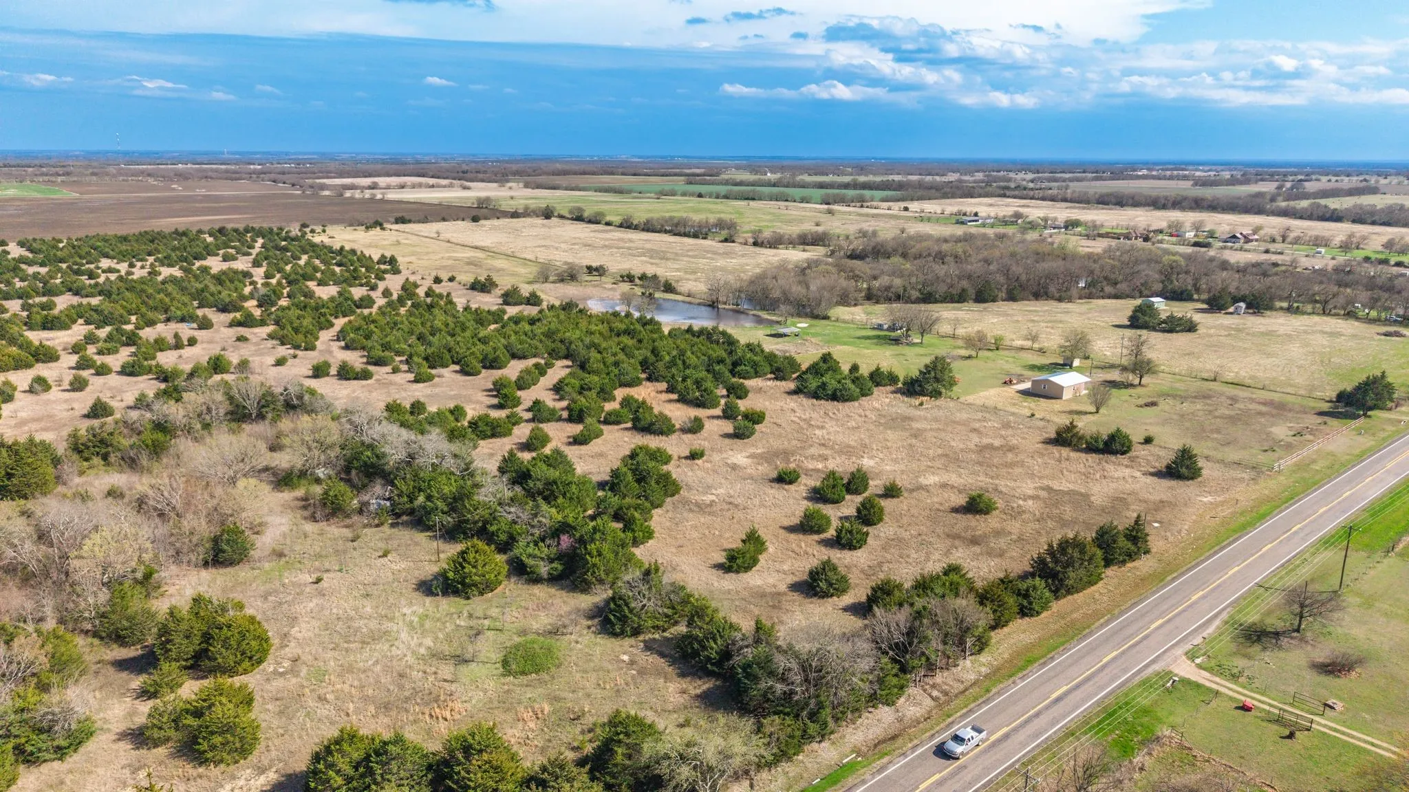 Aerial view of sparsely populated area with a nearby body of water