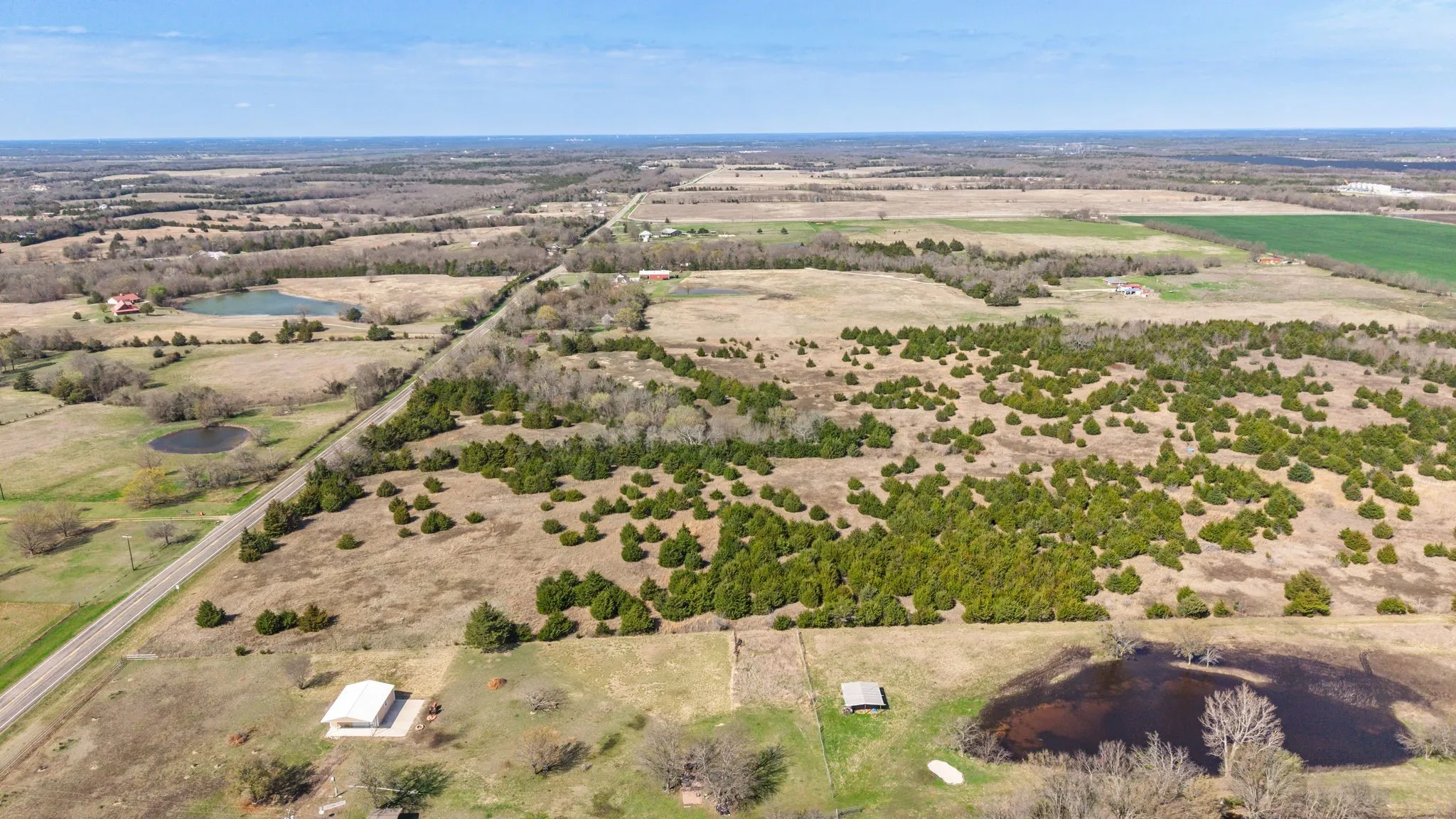 Aerial view of sparsely populated area with a large body of water