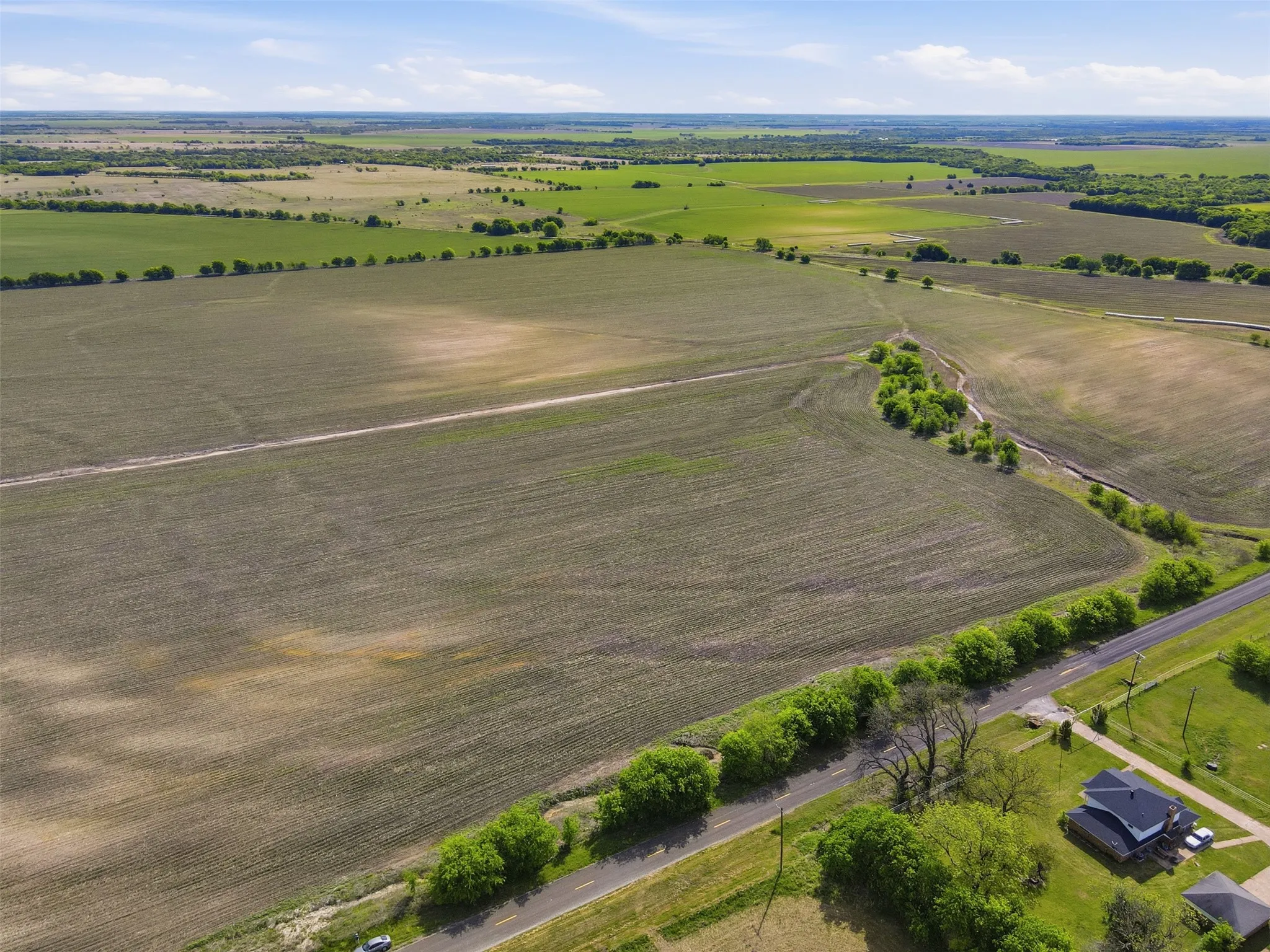 Aerial view of sparsely populated area featuring abundant farmland