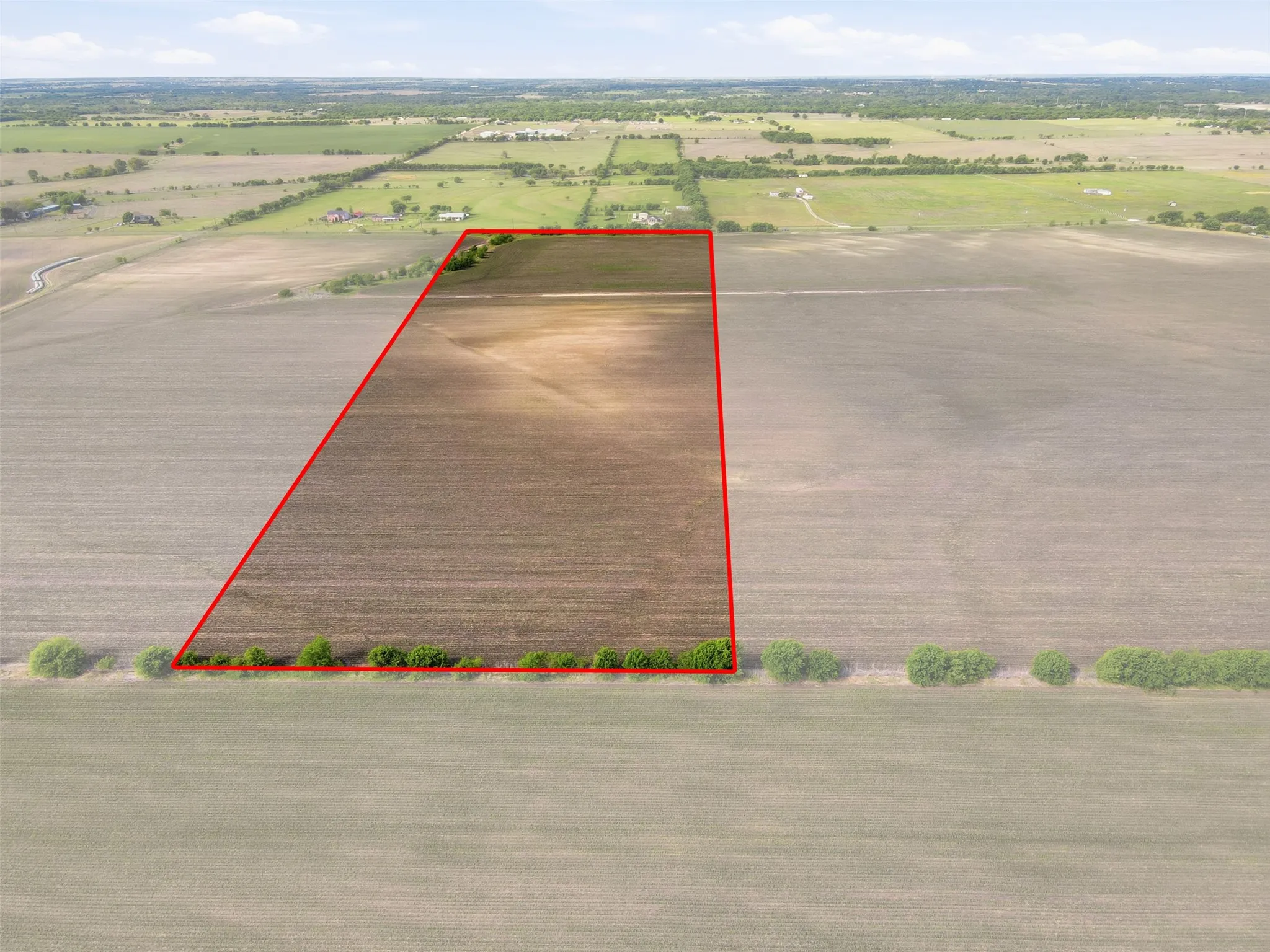 Overview of rural landscape with property boundaries highlighted and farmland