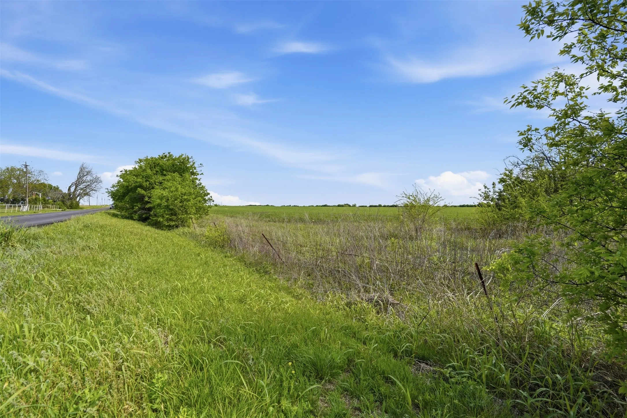 View of yard with a rural view