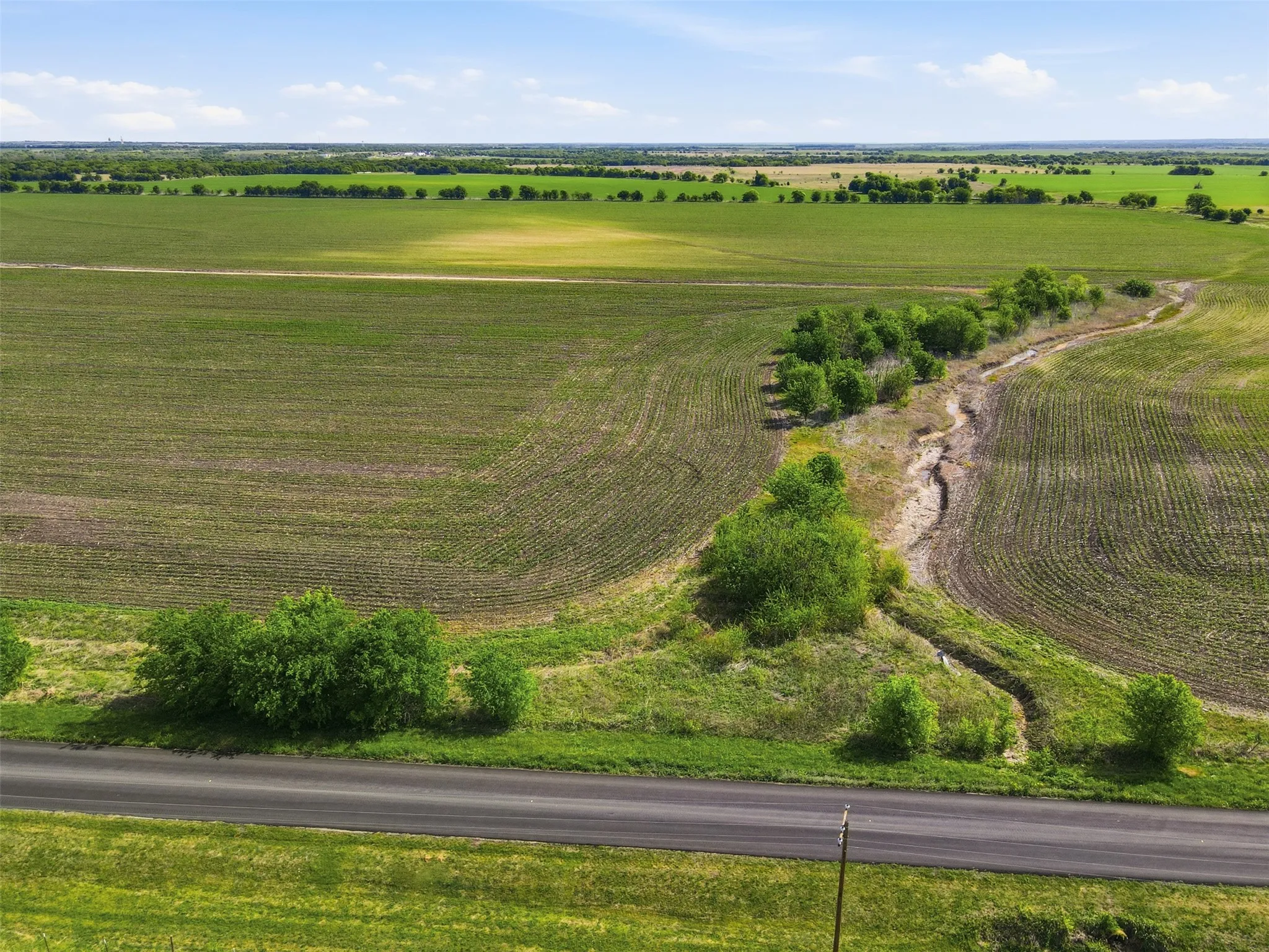 View of rural area with large plots for crops