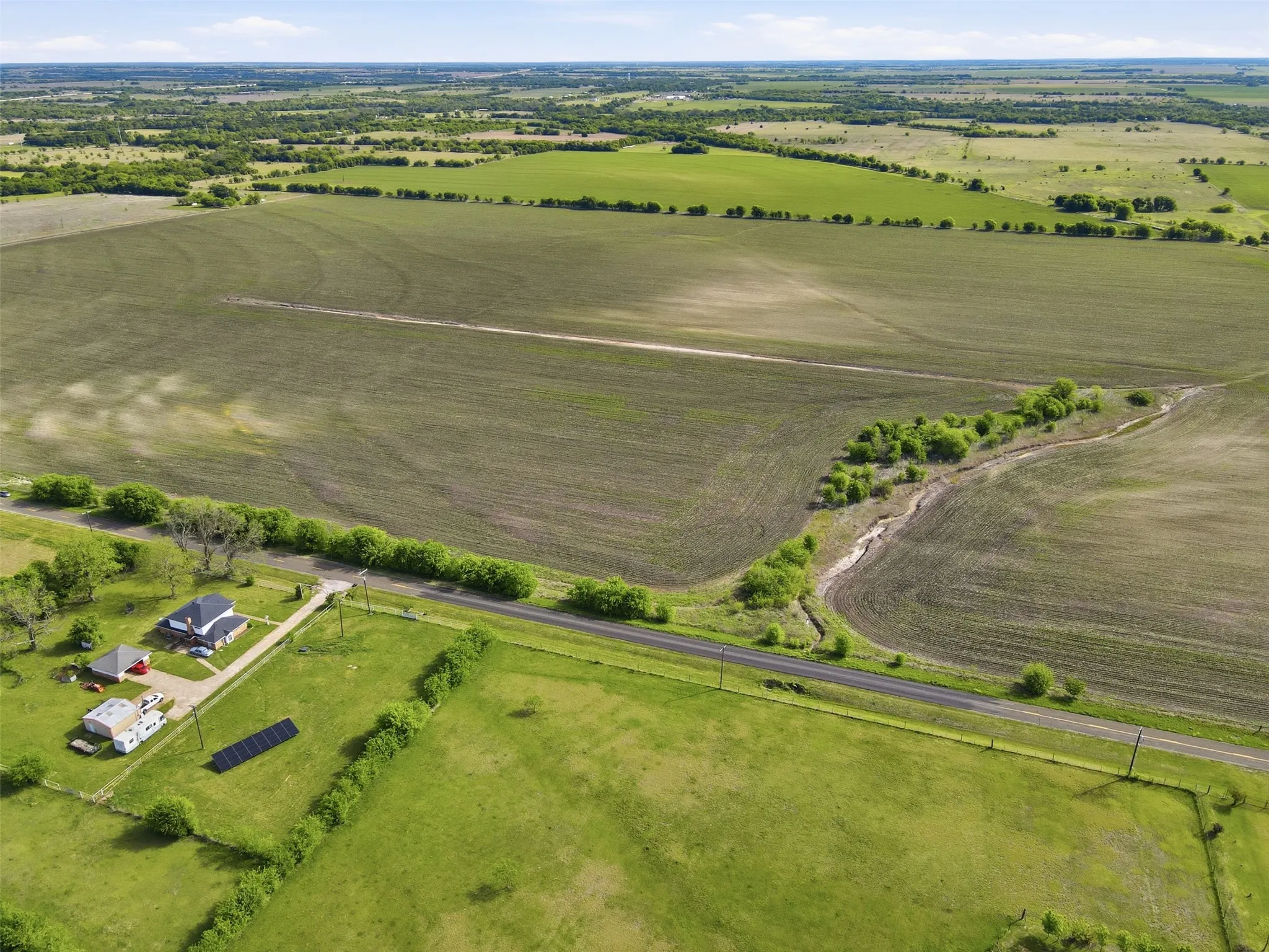 Aerial view of sparsely populated area with extensive farmland