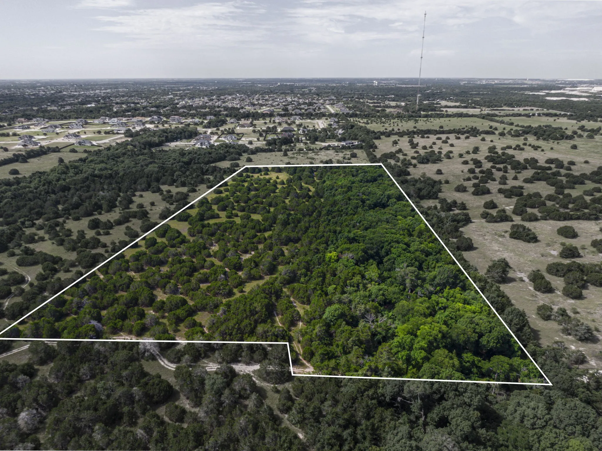 Aerial overview of property's location featuring property boundaries highlighted