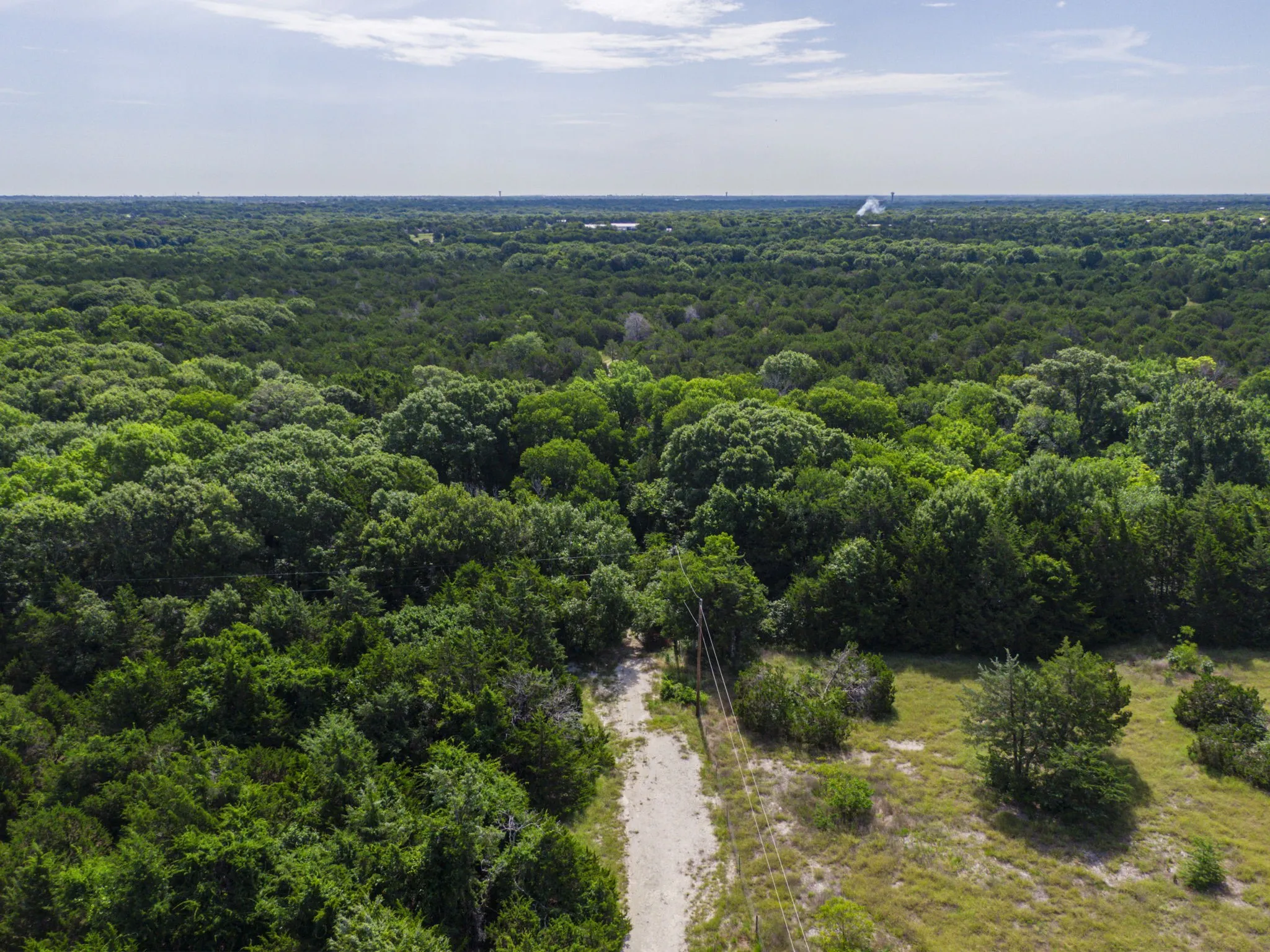 Aerial view of a heavily wooded area