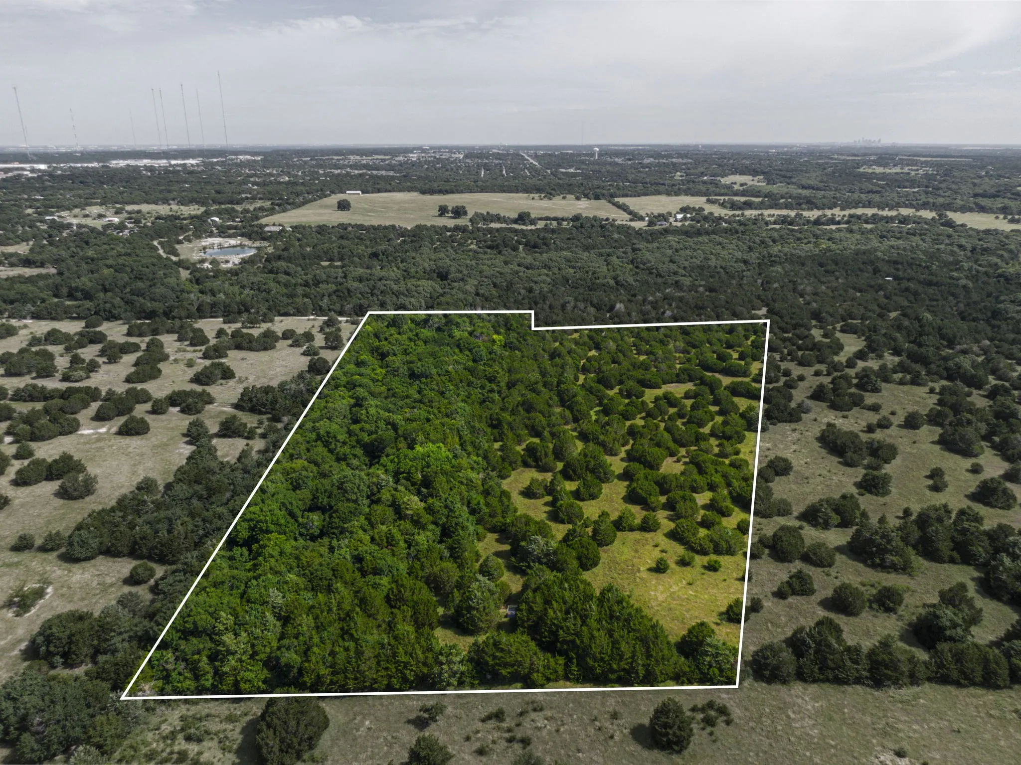 Aerial view of property and surrounding area with property boundaries highlighted