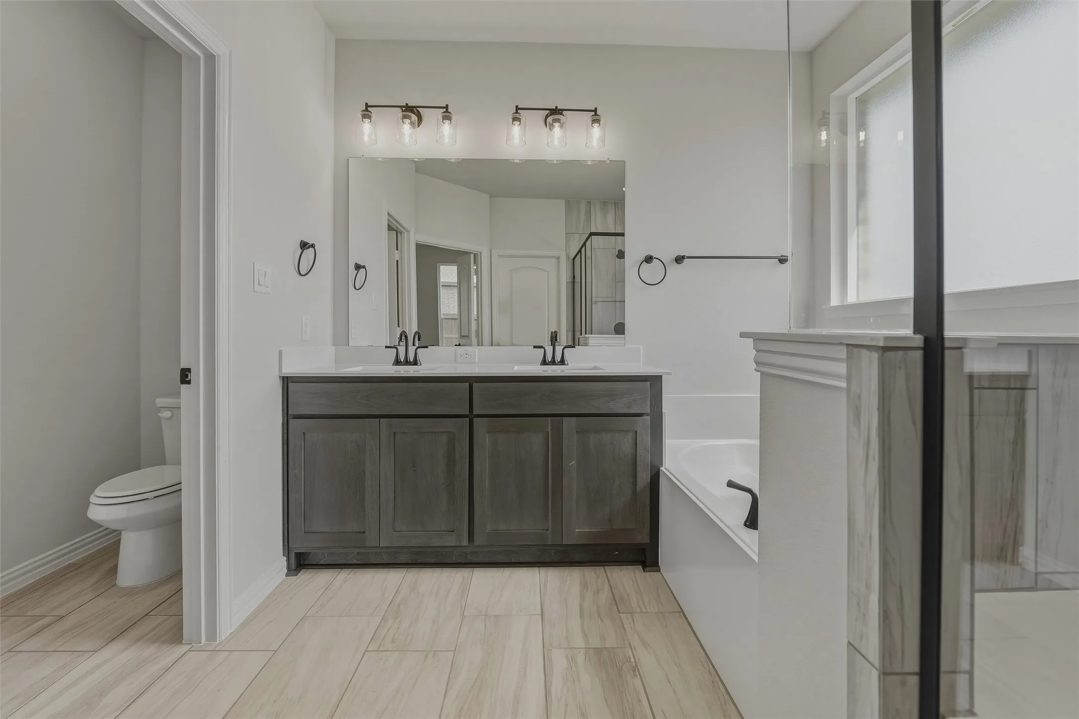 Dual vanity with quartz-style countertop and integrated sinks