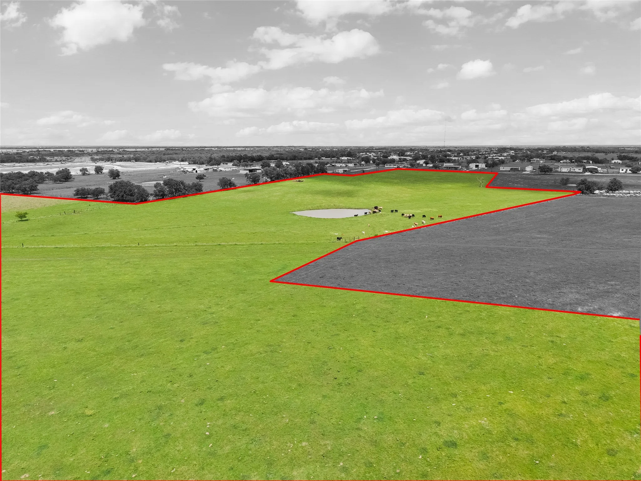Aerial view of property and surrounding area with property parcel outlined