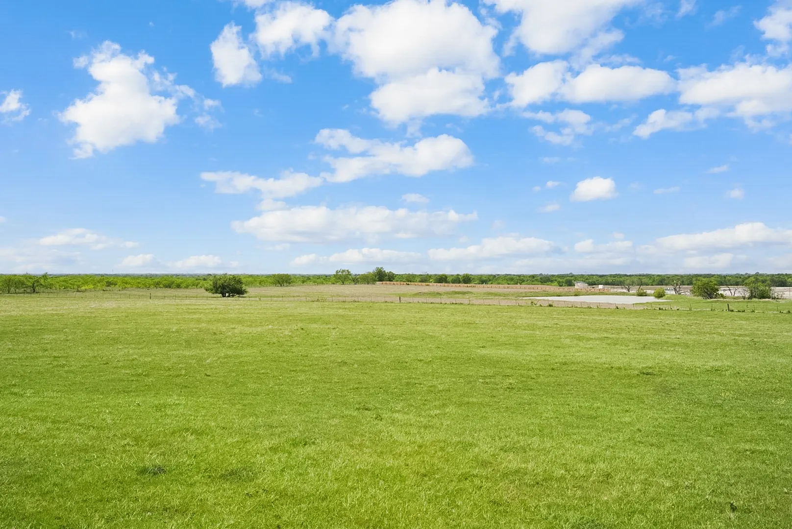 View of green lawn with a view of countryside