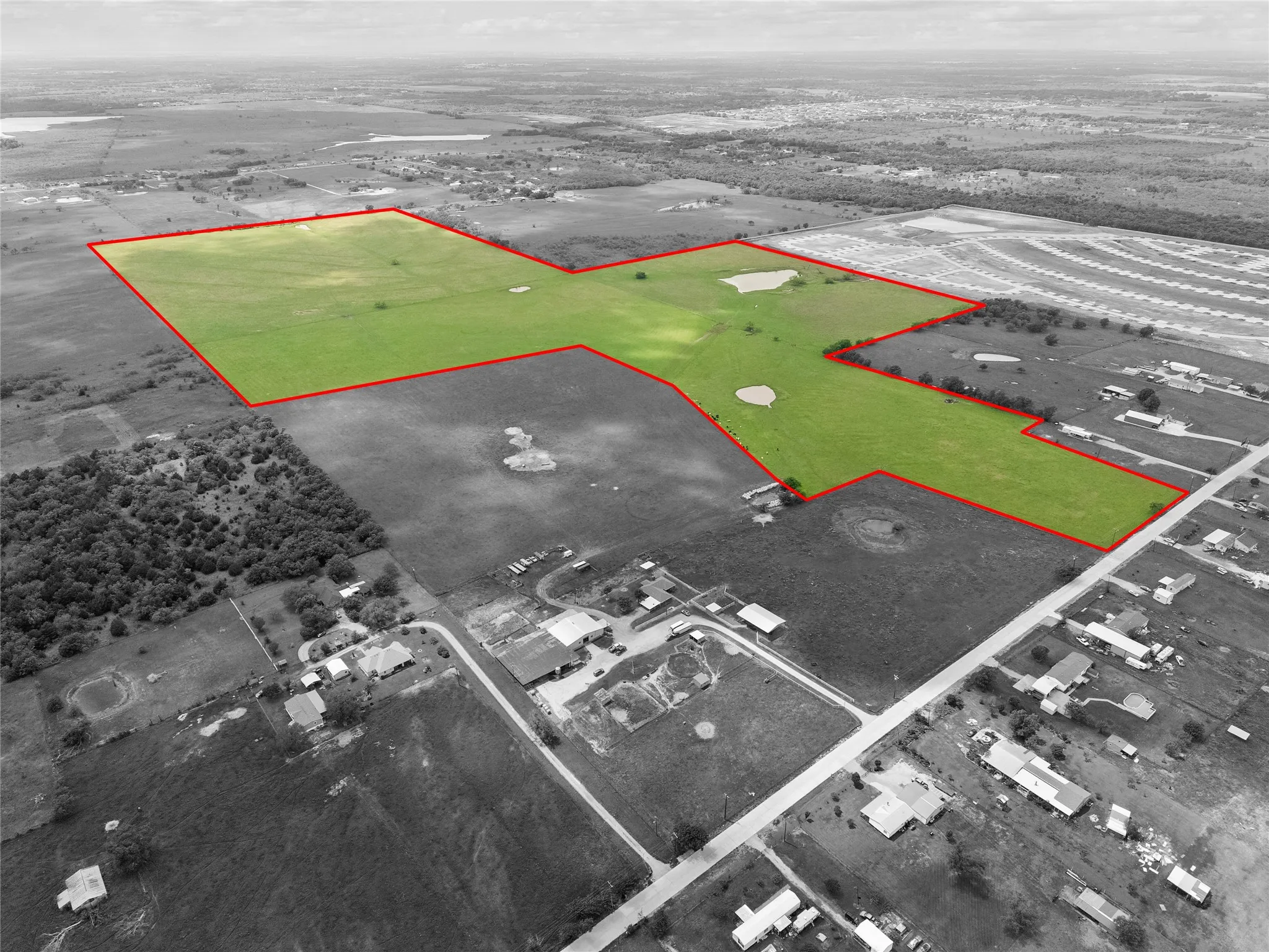 Aerial view of property's location featuring property parcel outlined