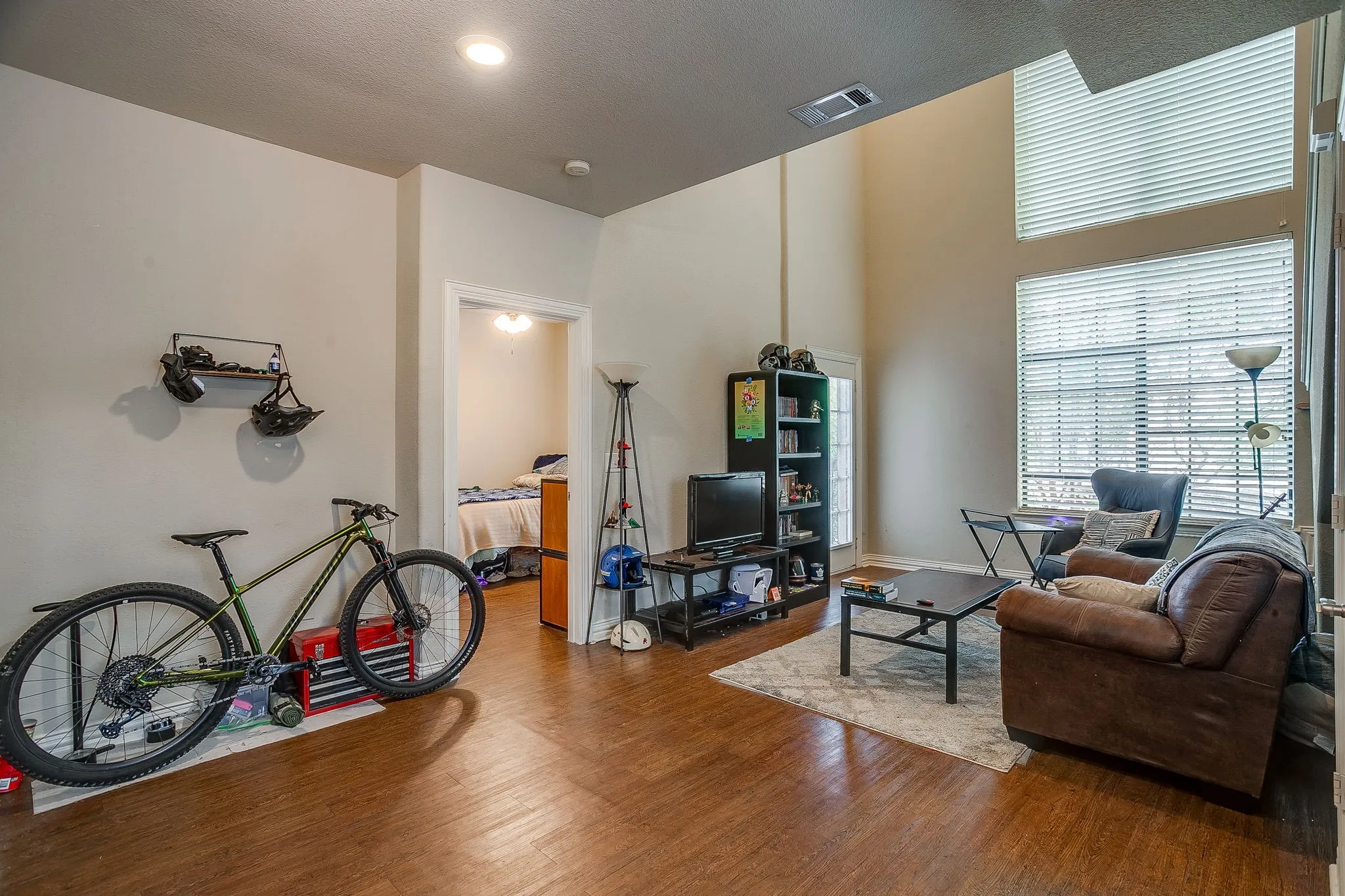 Living area with wood finished floors and baseboards