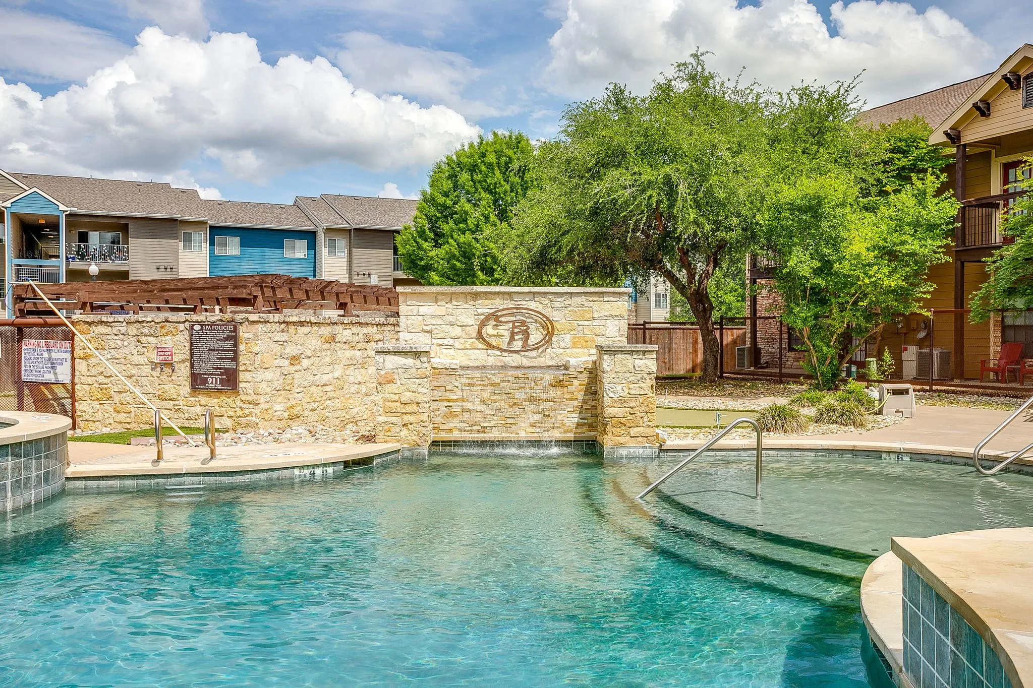 Community pool featuring a patio