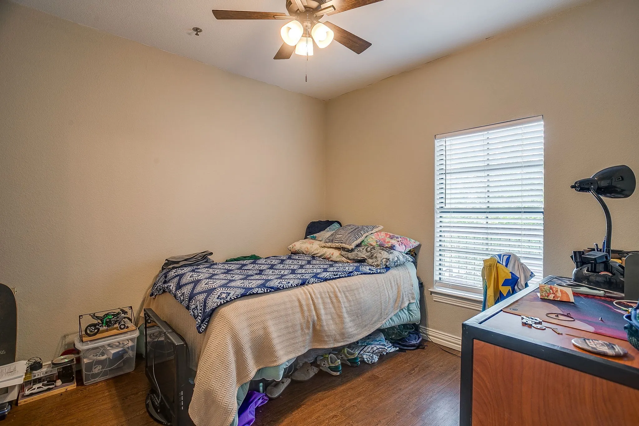 Bedroom featuring dark wood finished floors and a ceiling fan