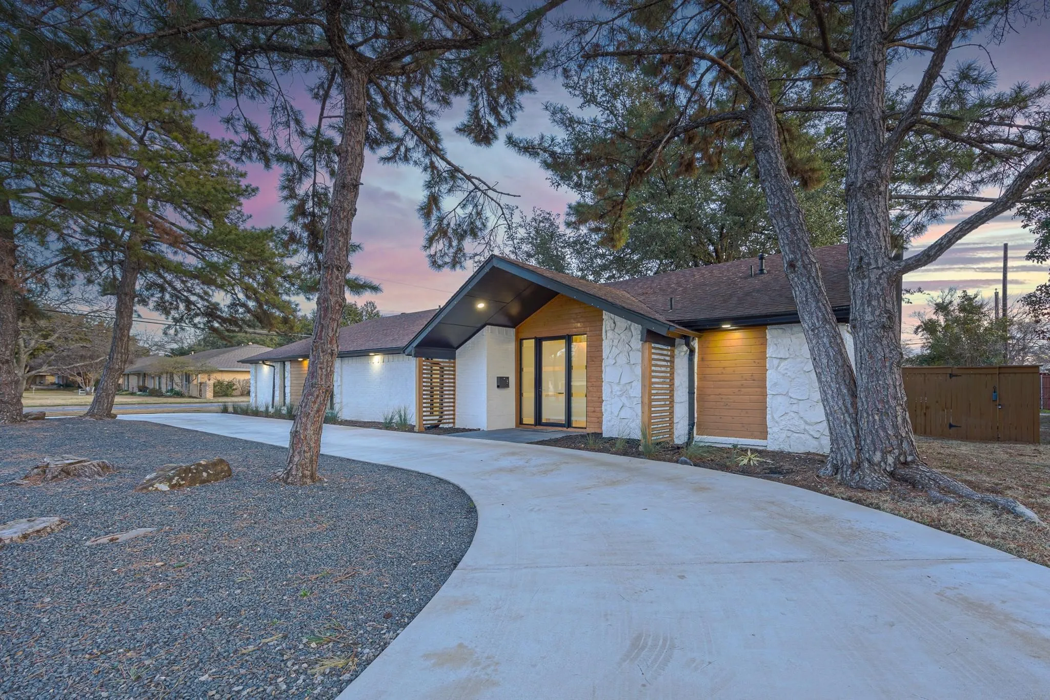 Dusk curb appeal under mature Glen Cove Park trees