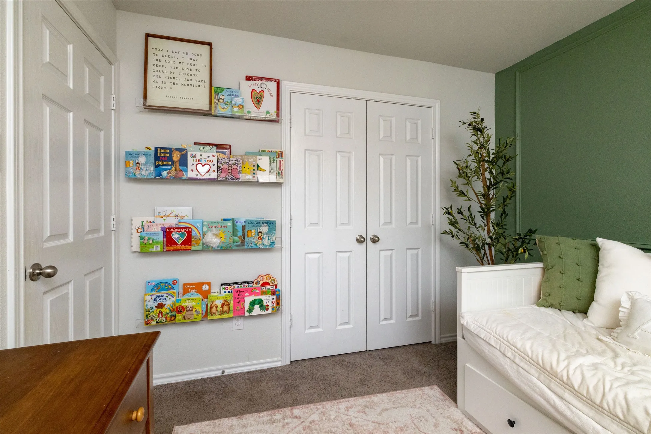 Bedroom with dark carpet and a closet