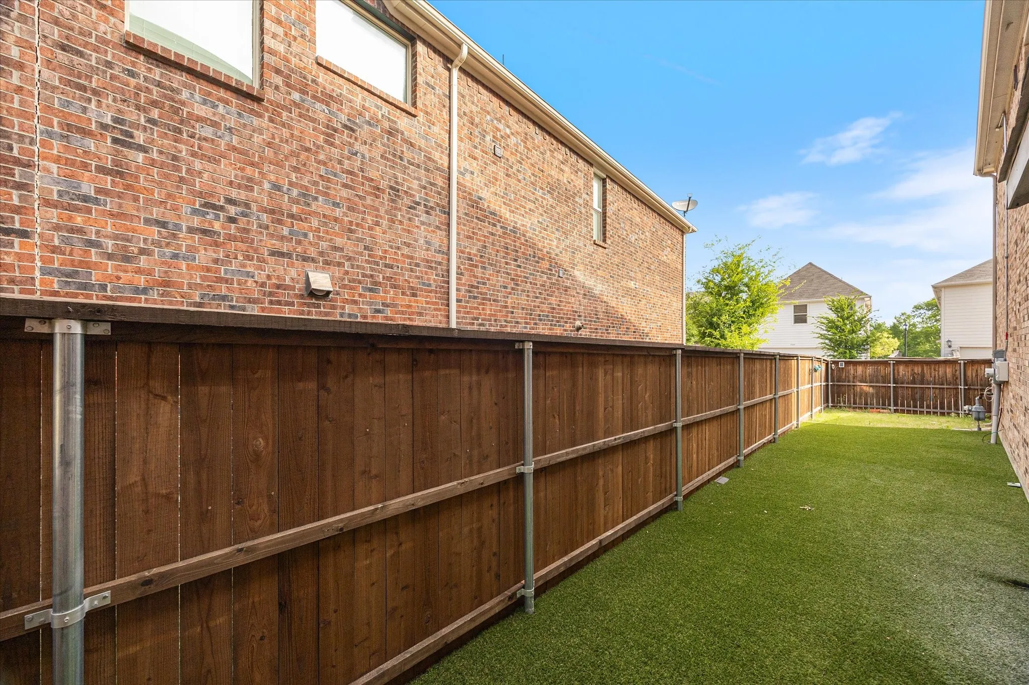 Backyard with artificial turf.
