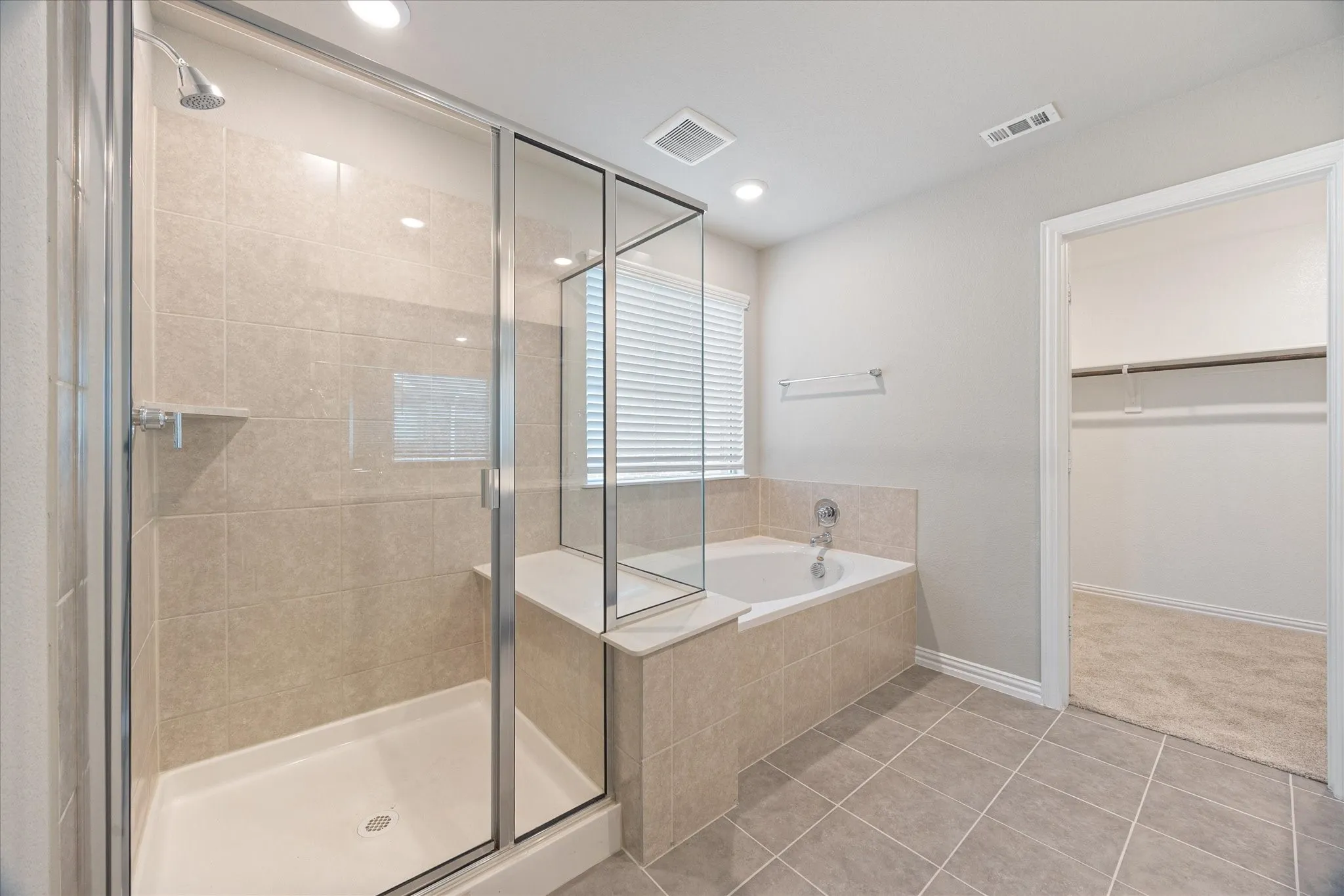 Separate shower, garden tub, and large walk-in closet.