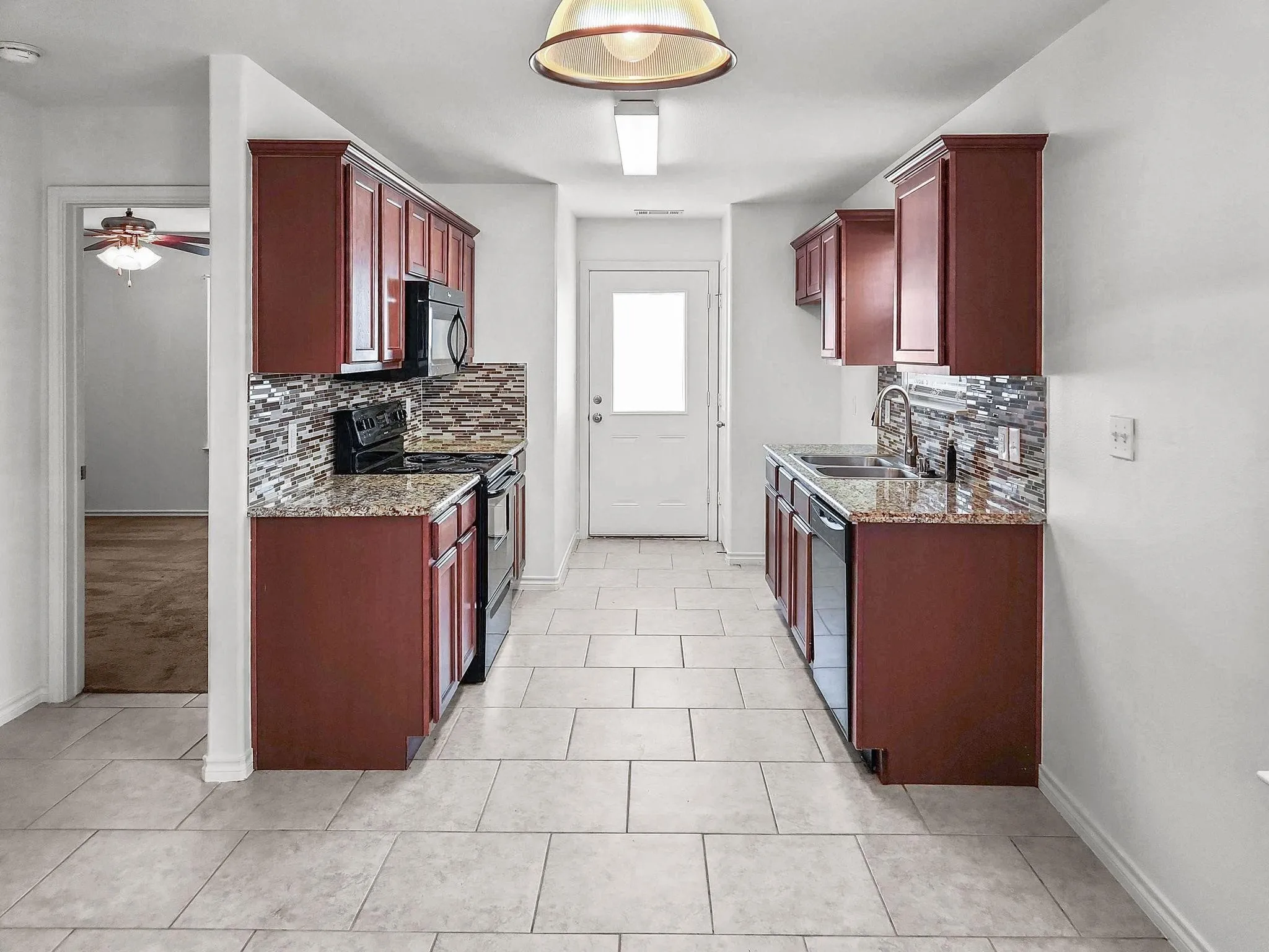 Kitchen with door to backyard - Unit 821