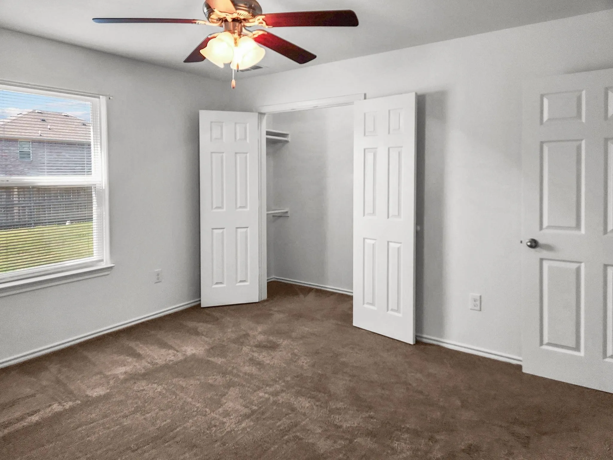 Primary bedroom located downstairs - Unit 821 - now has pergo-wood floors