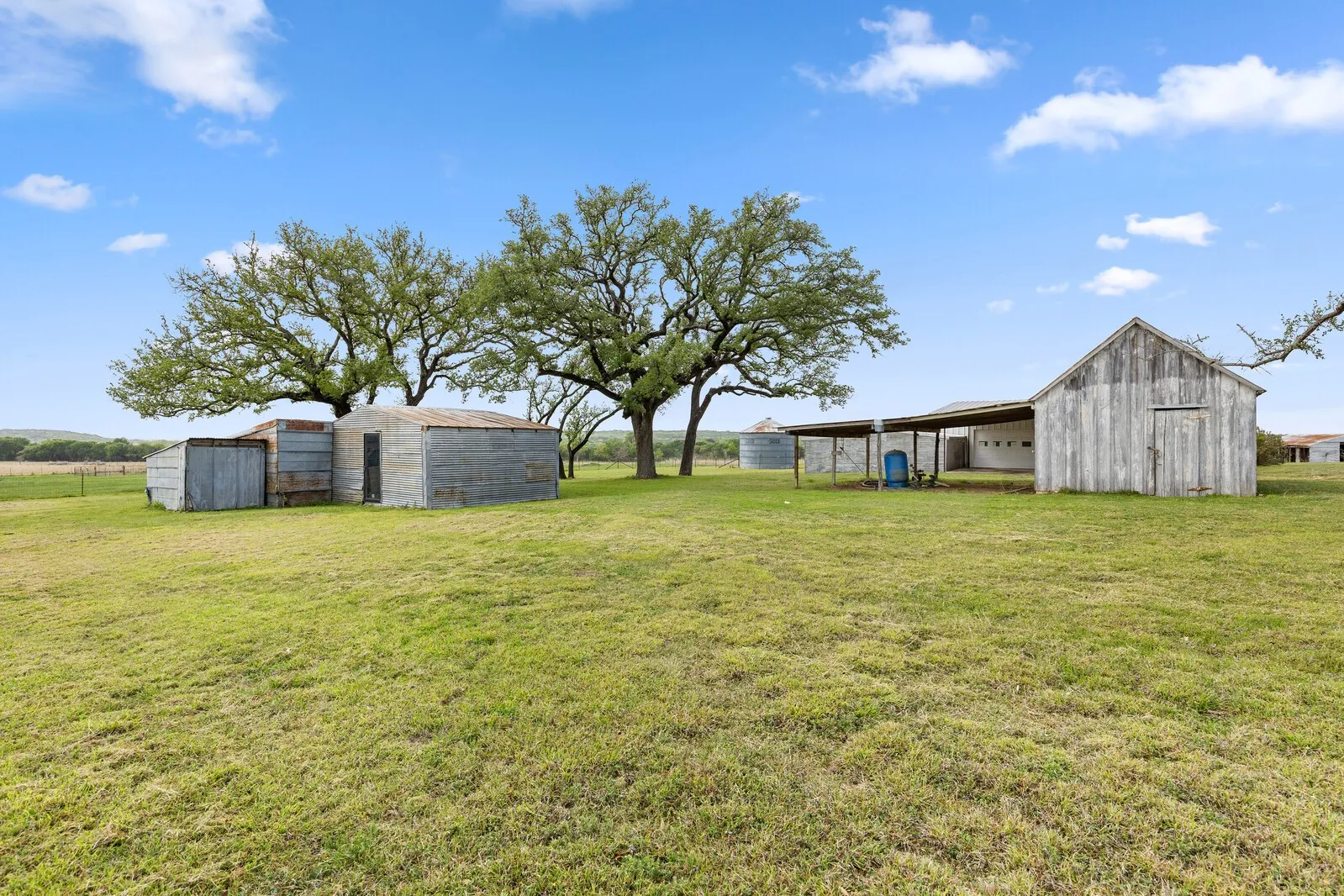 2 outbuildings .1 on the right includes a storm shelter