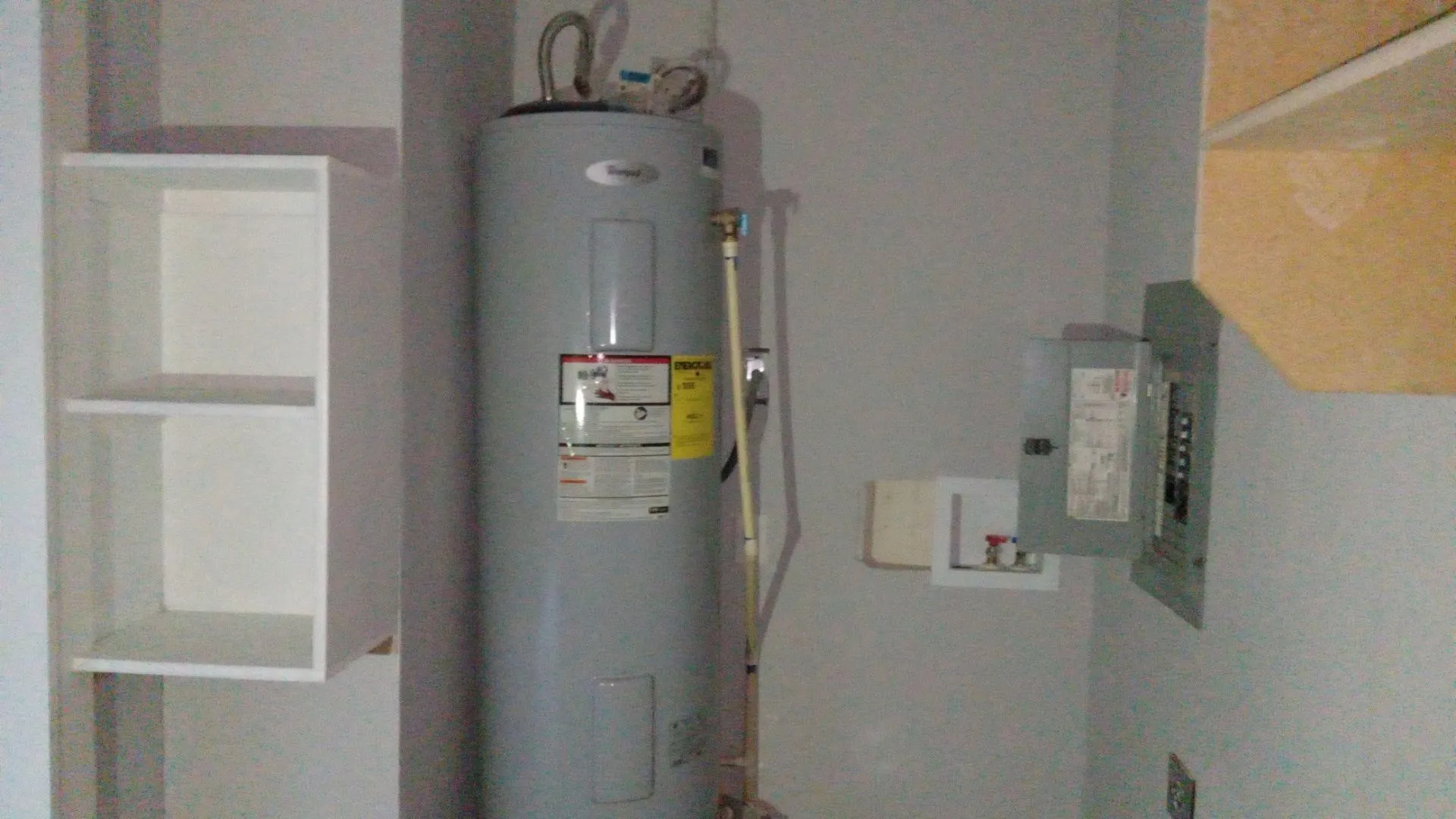 Utilities featuring electric water heater and electric panel
