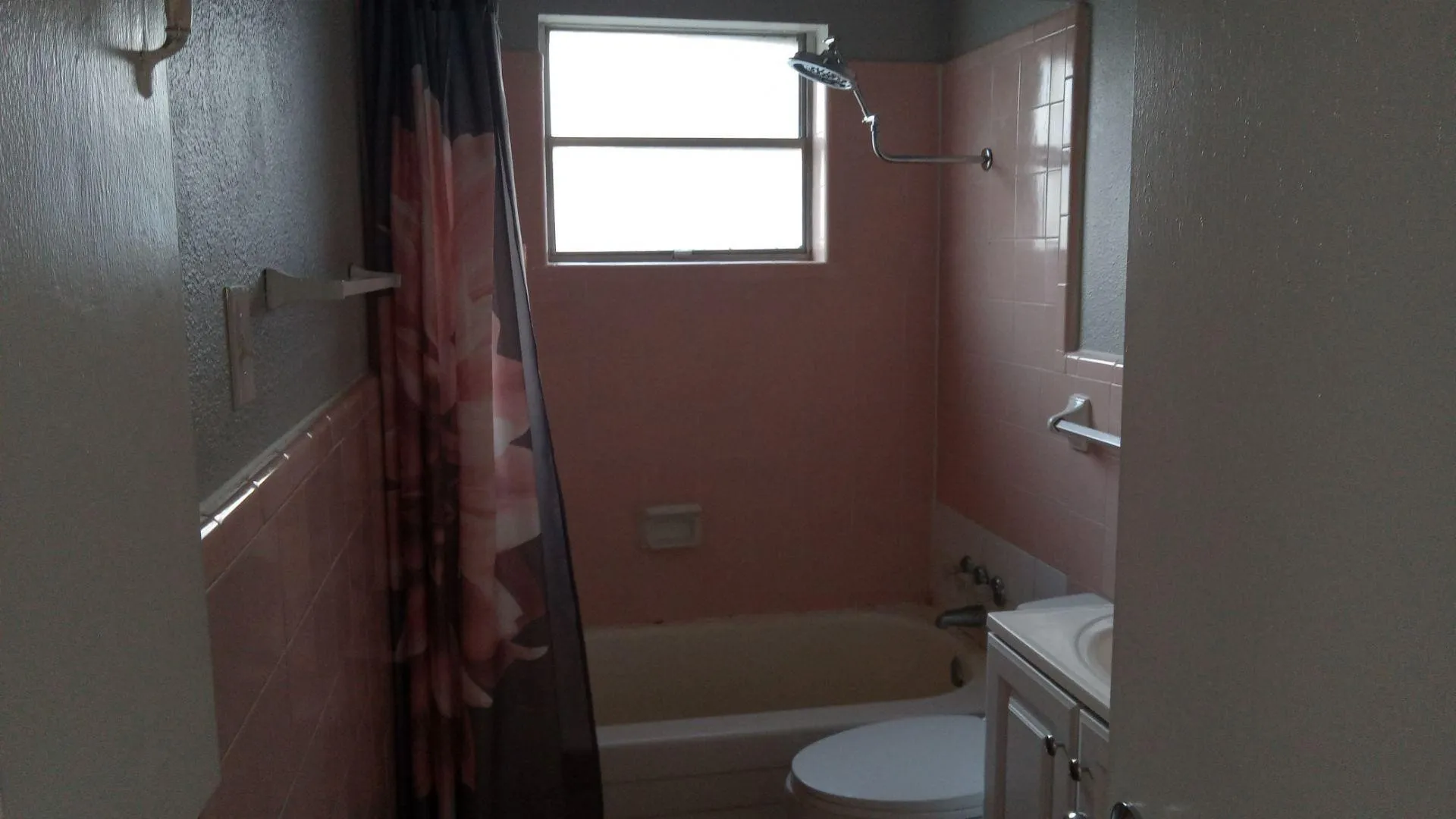 Bathroom featuring shower / tub combo with curtain and vanity