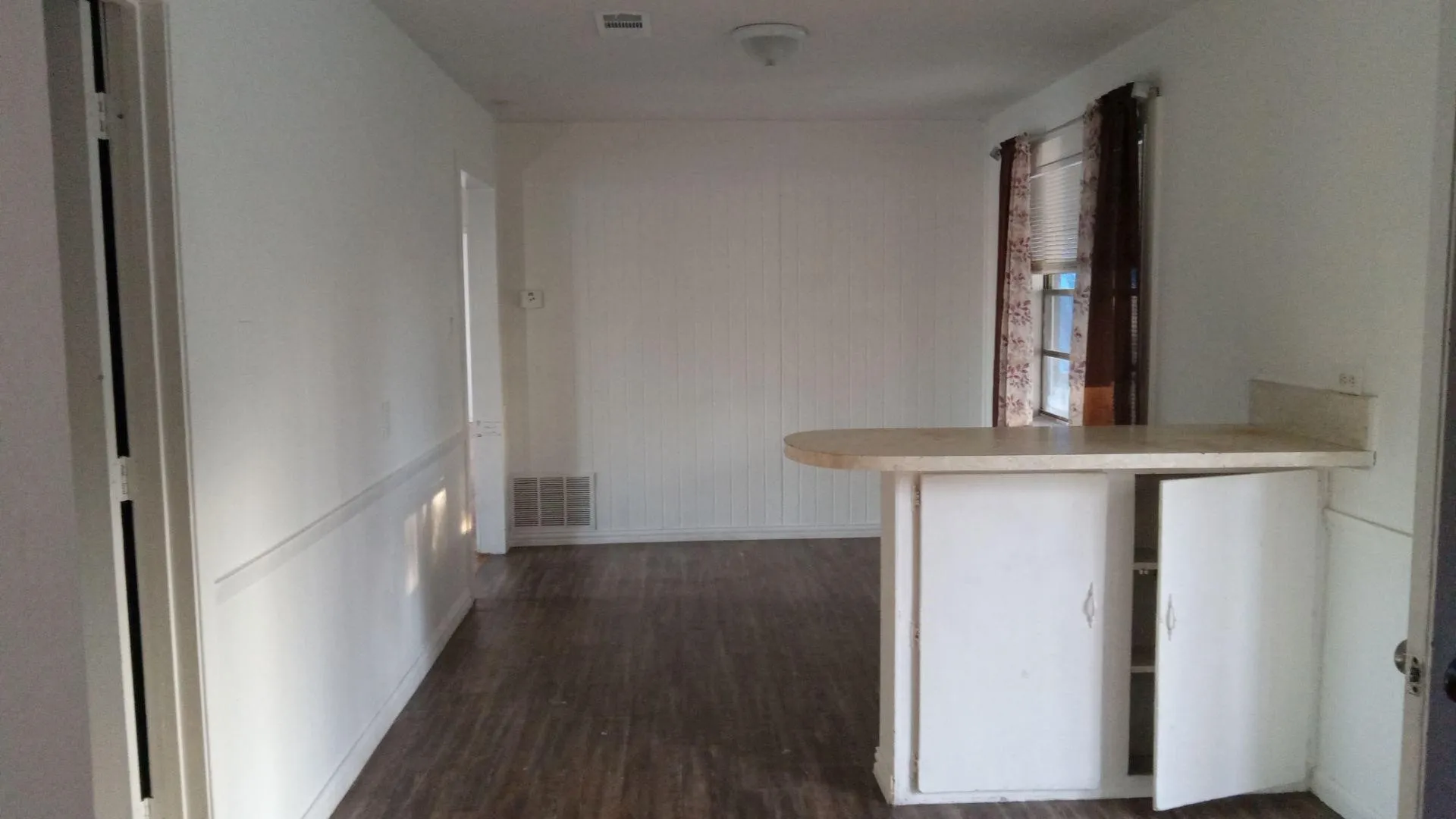Hall featuring dark wood finished floors