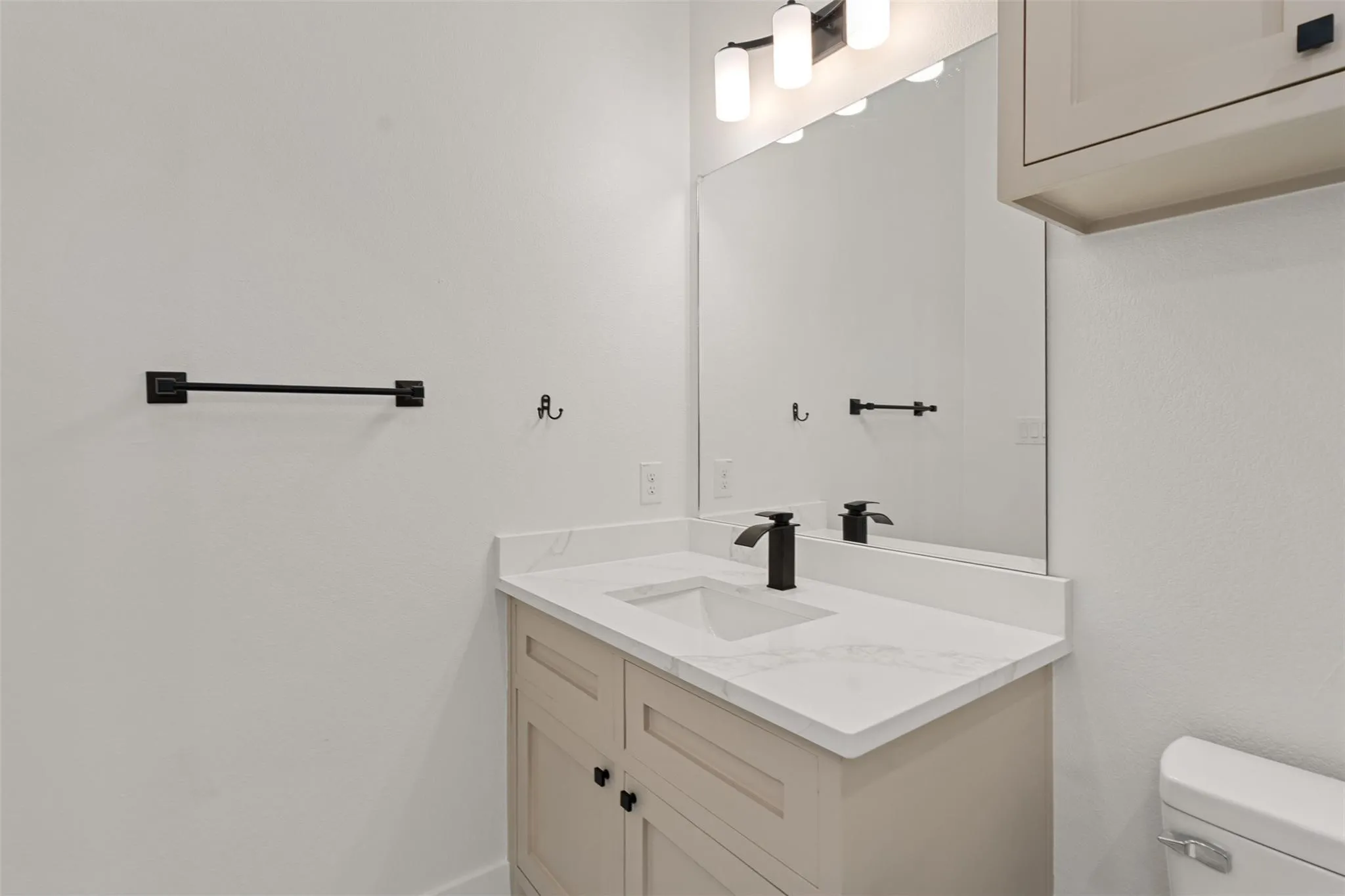 Bathroom featuring toilet and vanity