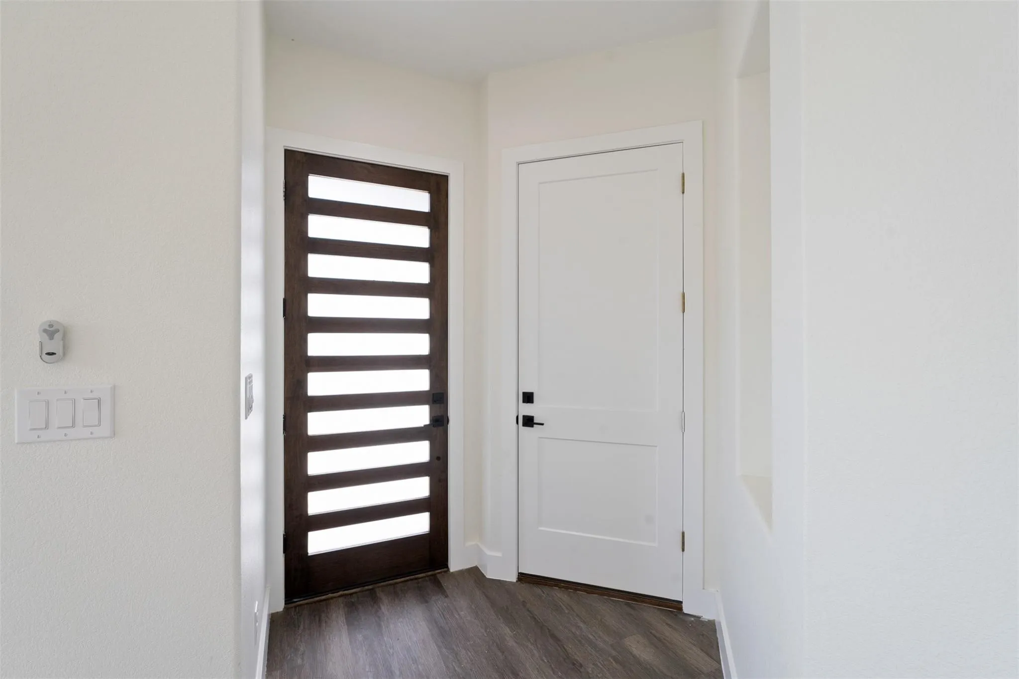 Entrance foyer with dark wood finished floors