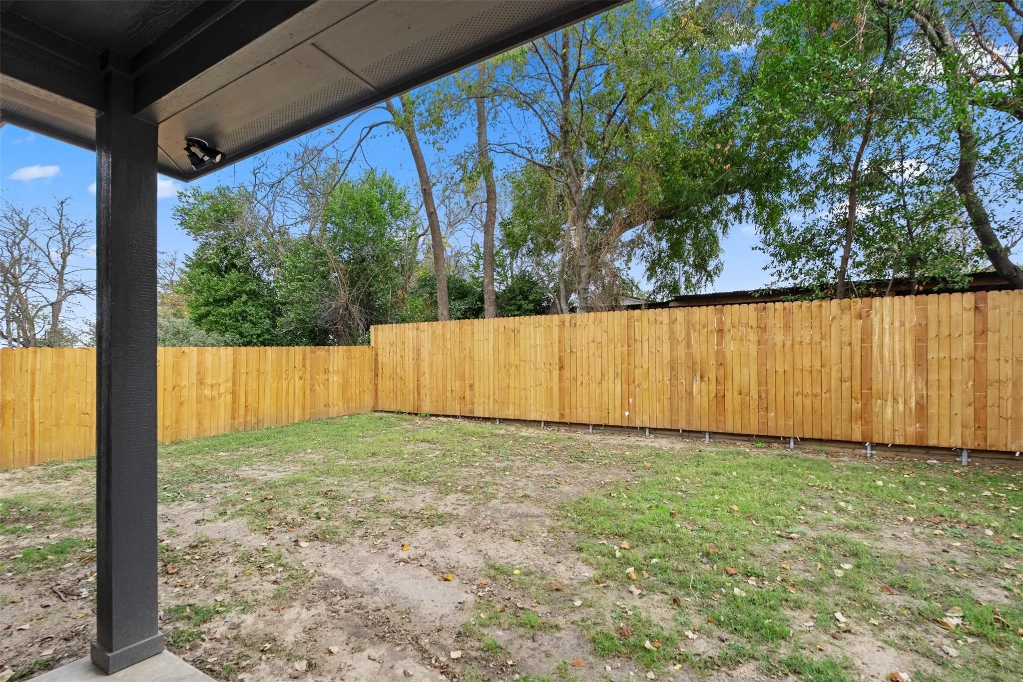 View of fenced backyard