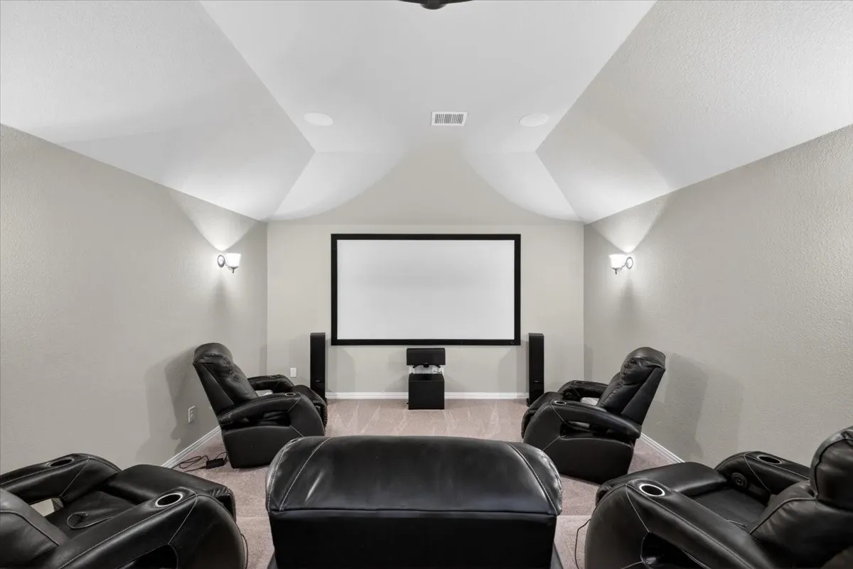 5 movie chairs, projector, mini fridge all stays for perfect at home theater.