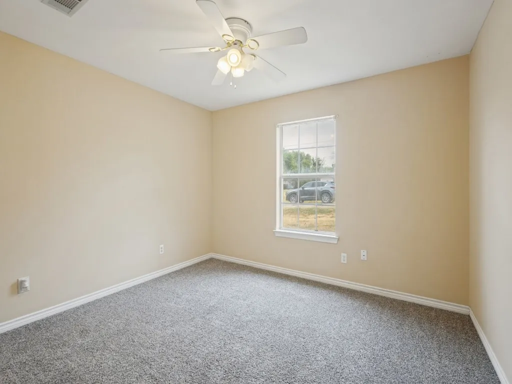 Secondary bedroom with neutral coloring ready for your designs