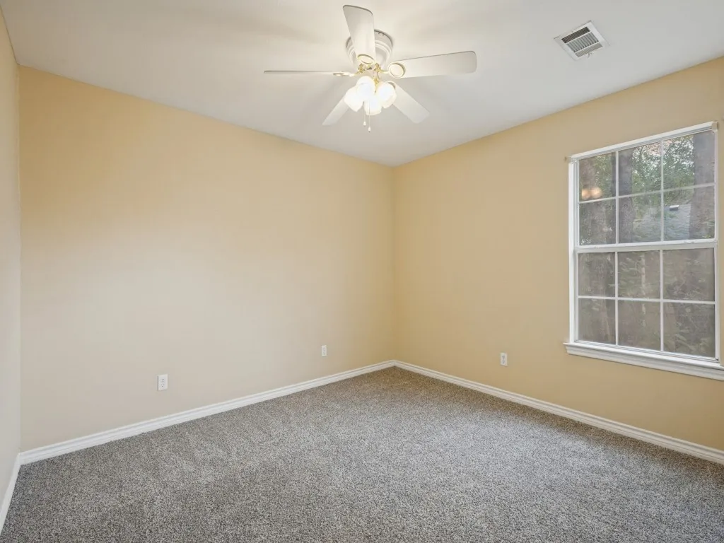 Secondary bedroom with closet