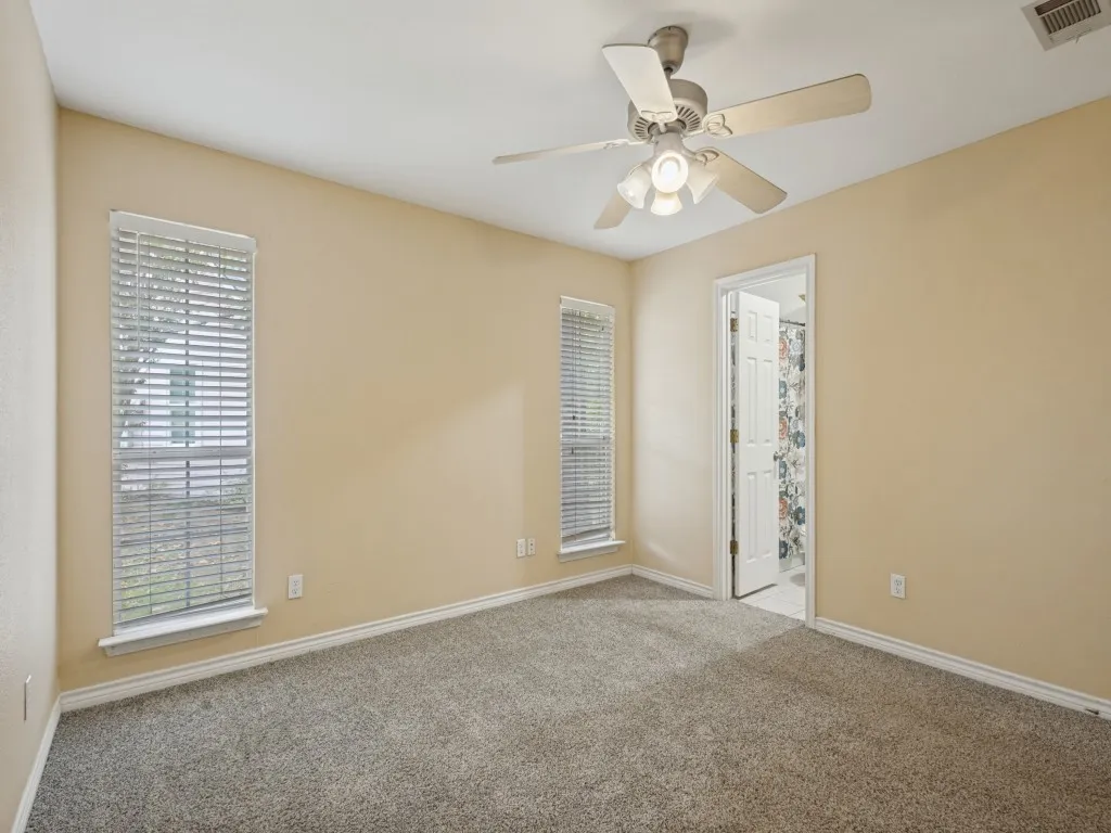 Primary bedroom is separate from secondary bedrooms for a private suite.