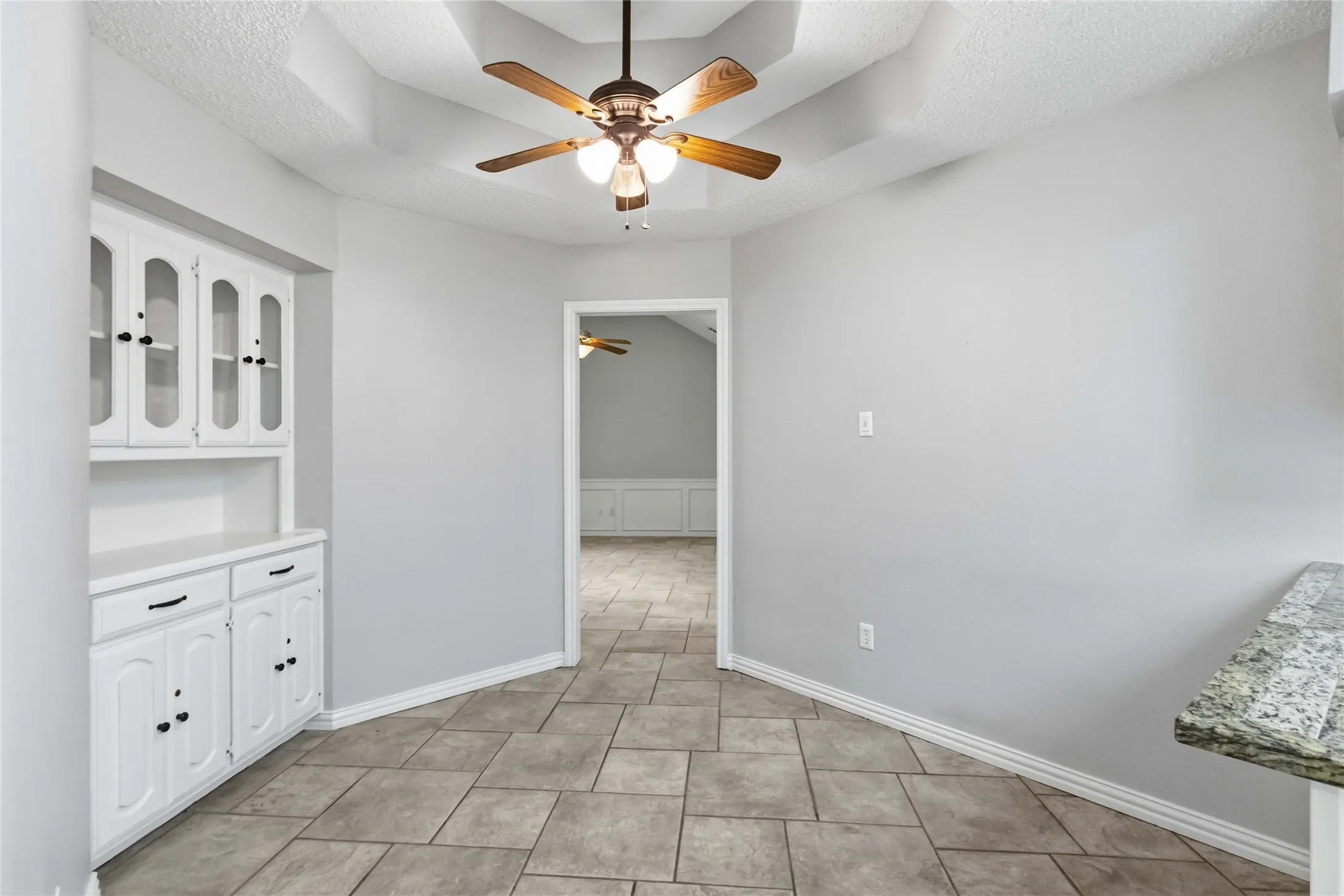 Dining or breakfast area at 200 Sunny Crest Dr, Murphy TX in the Timbers 3 community with chandelier lighting and natural light.