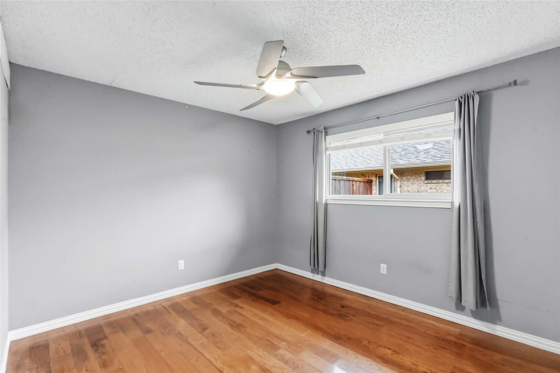 Bedroom at 200 Sunny Crest Dr, Murphy TX in Timbers 3 with natural light and updated flooring.