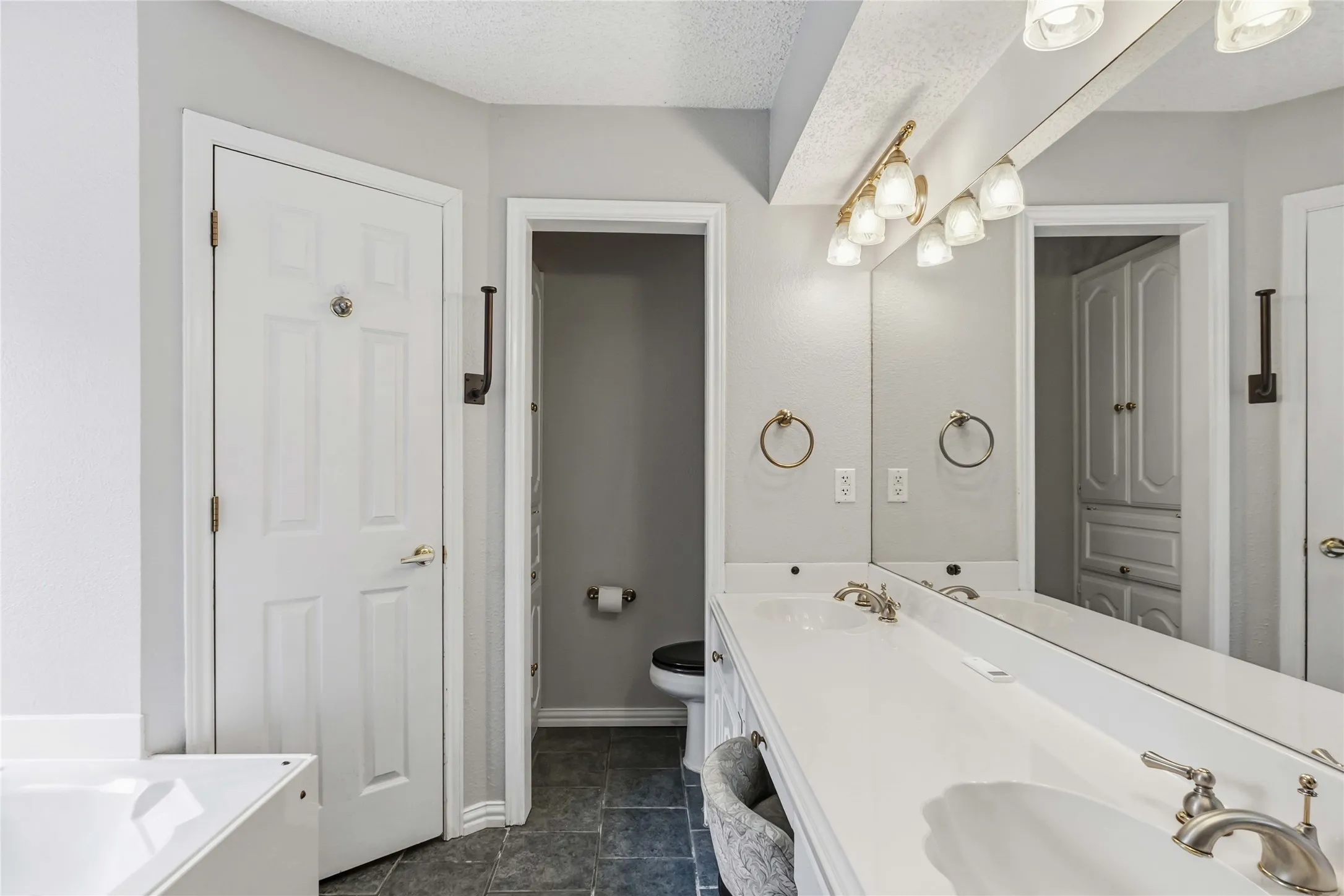Bathroom vanity area at 200 Sunny Crest Dr, Murphy TX in Timbers 3 with updated lighting and ample counter space.
