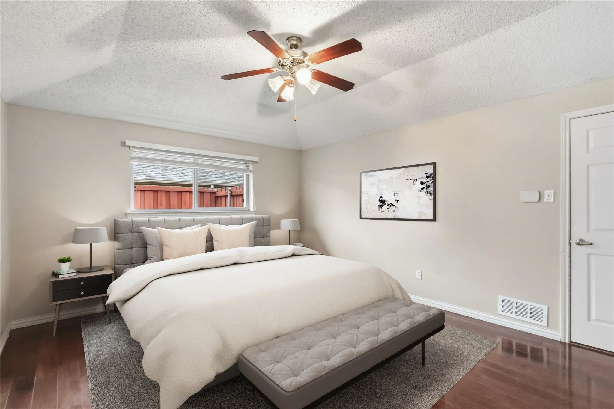 Primary Bedroom at 200 Sunny Crest Dr, Murphy TX in the Timbers 3 community with wood flooring, ceiling fan, and neutral tones.