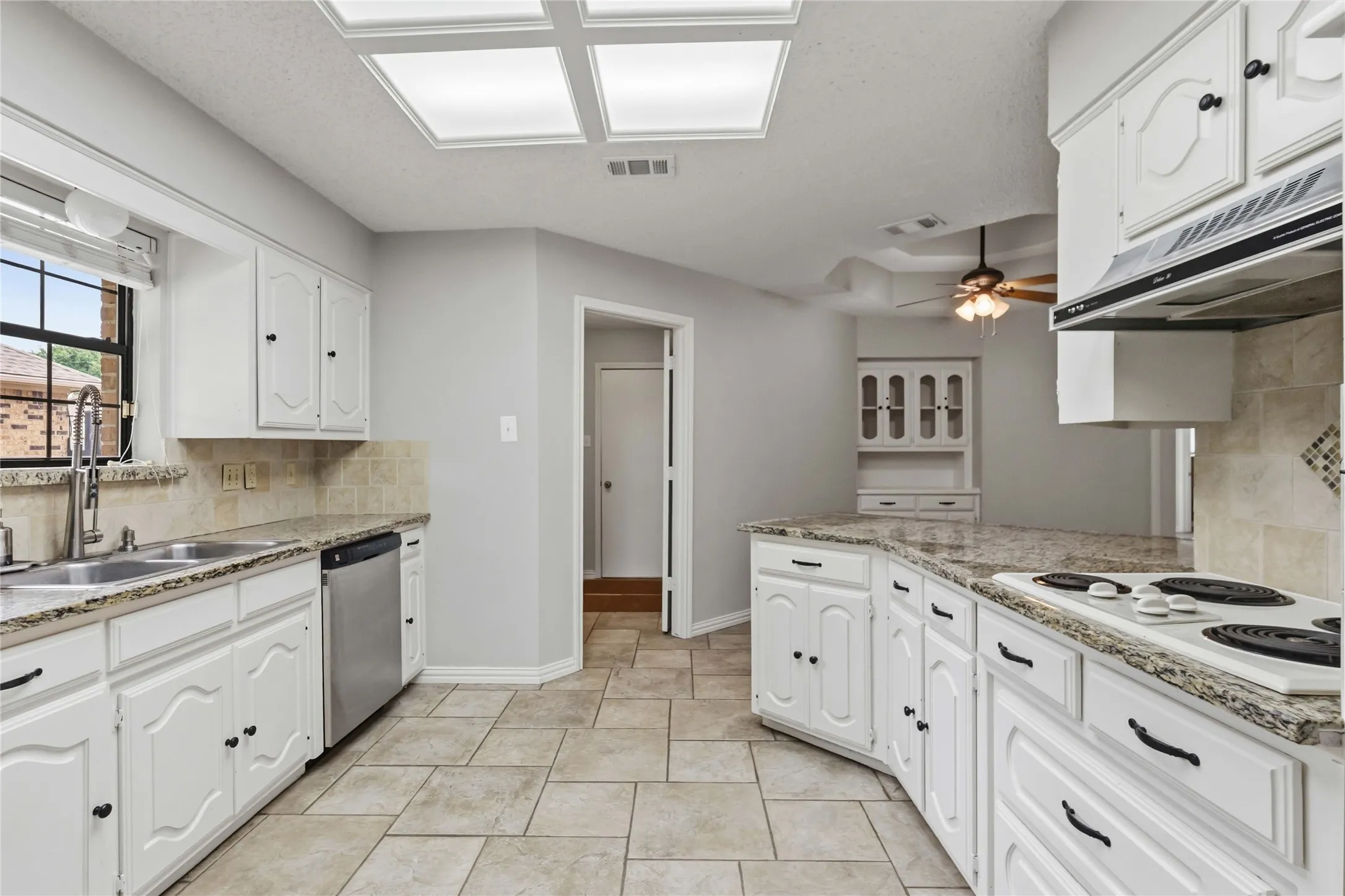 Kitchen with breakfast area at 200 Sunny Crest Dr, Murphy TX in Timbers 3 offering ample cabinet space and efficient layout.
