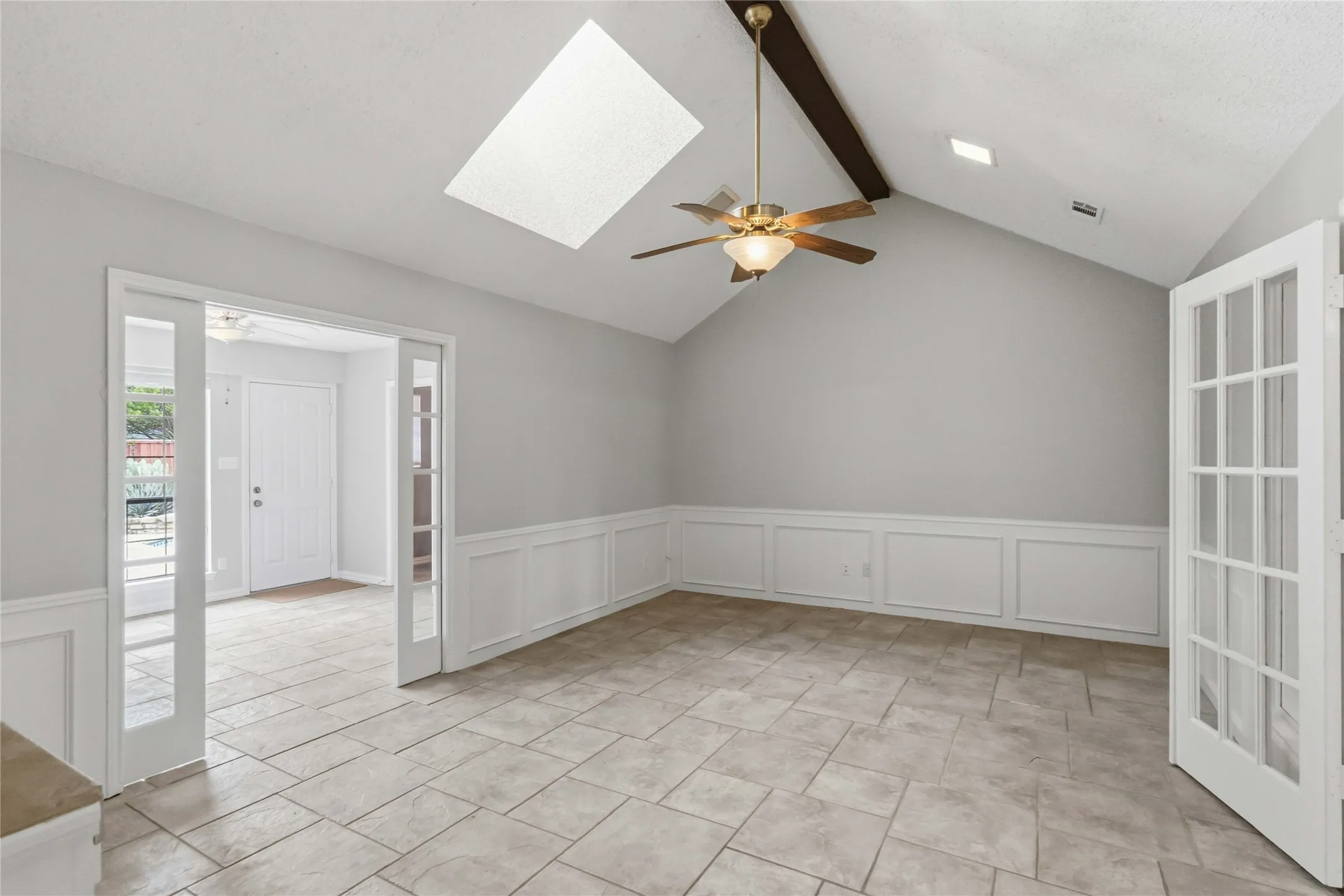 Flex space at 200 Sunny Crest Dr, Murphy TX in Timbers 3 featuring skylights and French doors, ideal for office or second living area.