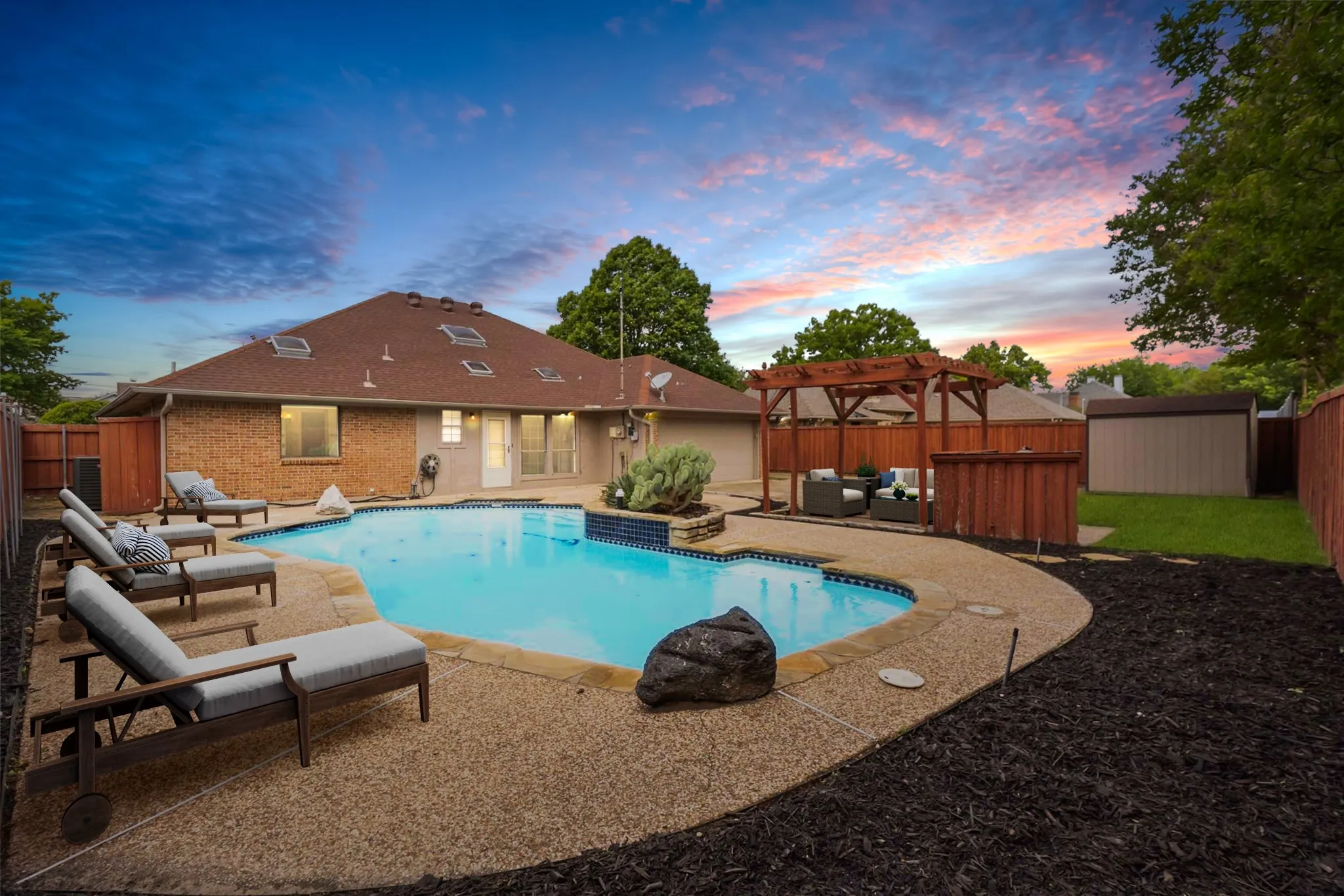 Backyard at 200 Sunny Crest Dr, Murphy TX in the Timbers 3 community featuring a private in-ground pool and extended patio space.