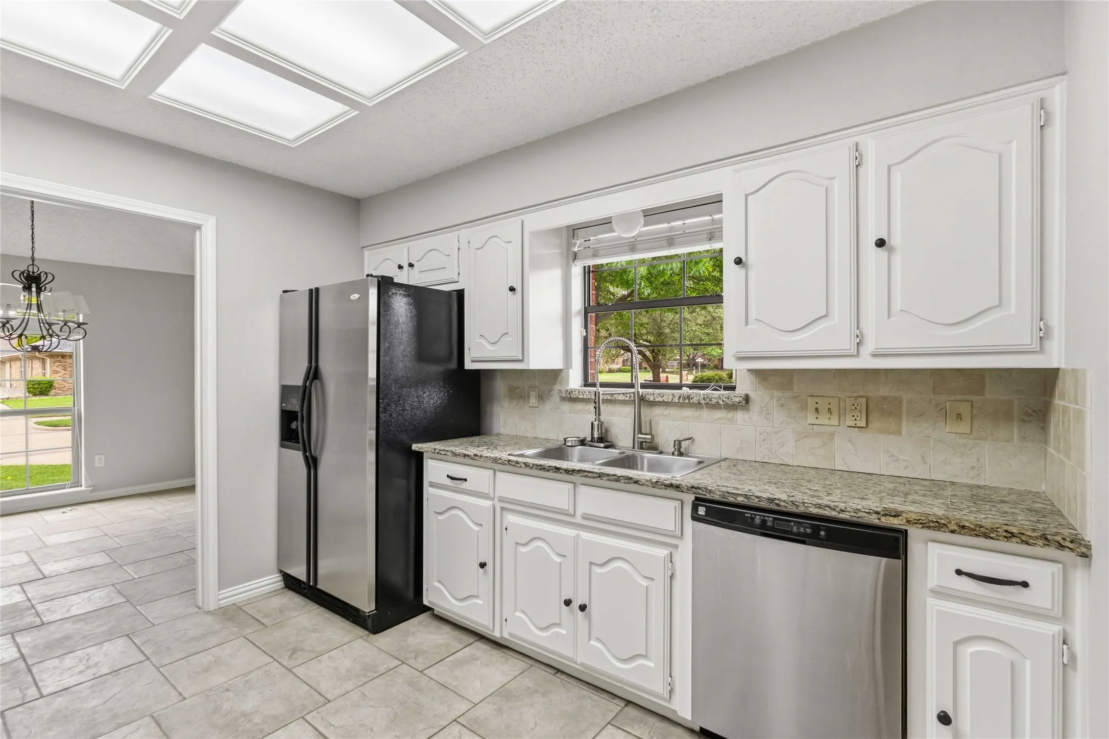Kitchen at 200 Sunny Crest Dr, Murphy TX in Timbers 3 with electric cooktop, built-in oven, and pantry storage.
